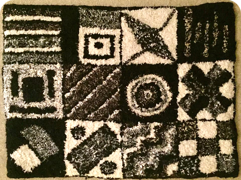 Black and white hooked rag rug maltese tile design