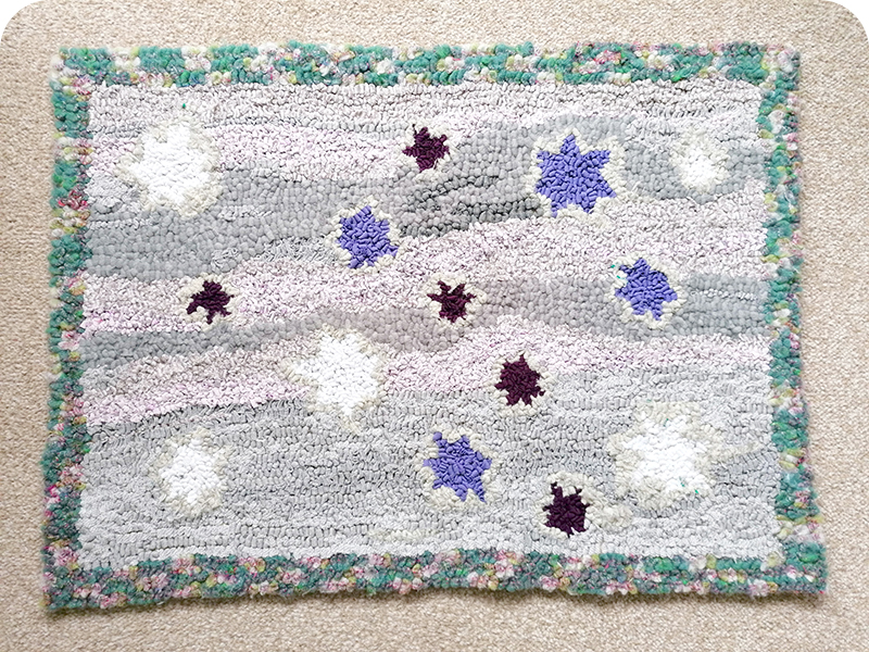 Hooked star rag rug