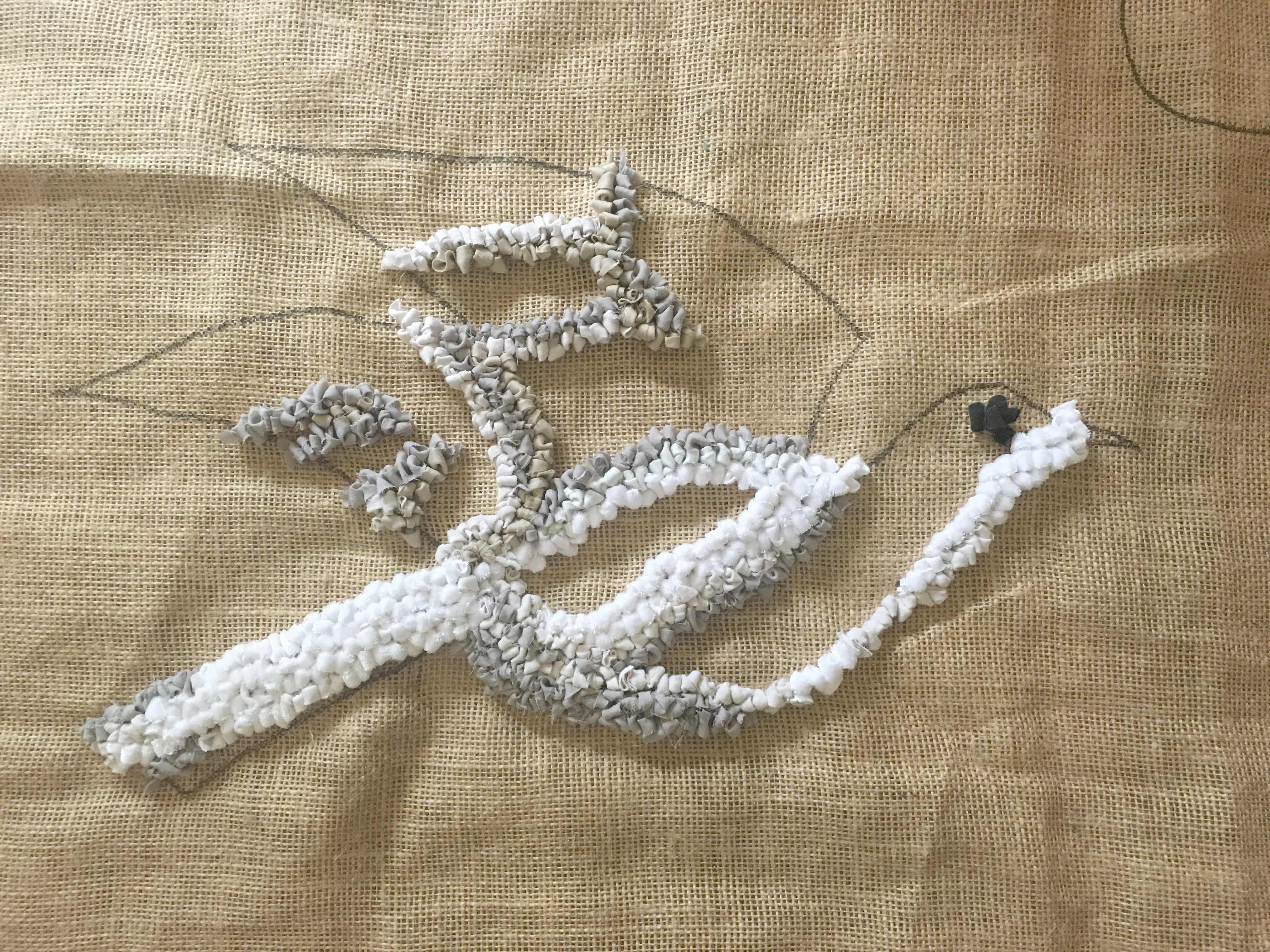 The Beginning of a Rag Rug Commission of a Dove on hessian