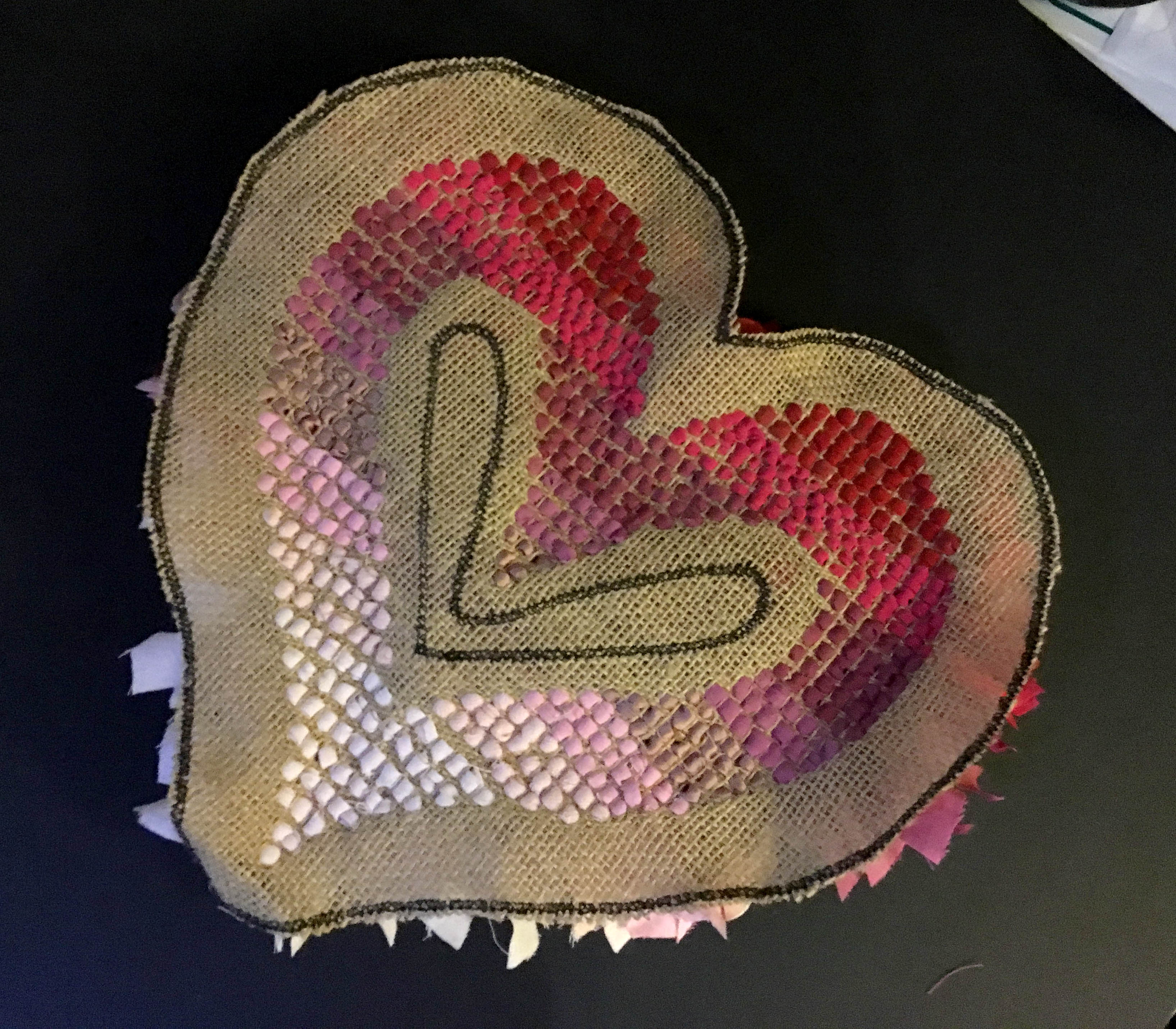 Back of Shaggy Rag Rug Heart on the Hessian in red, pink and white