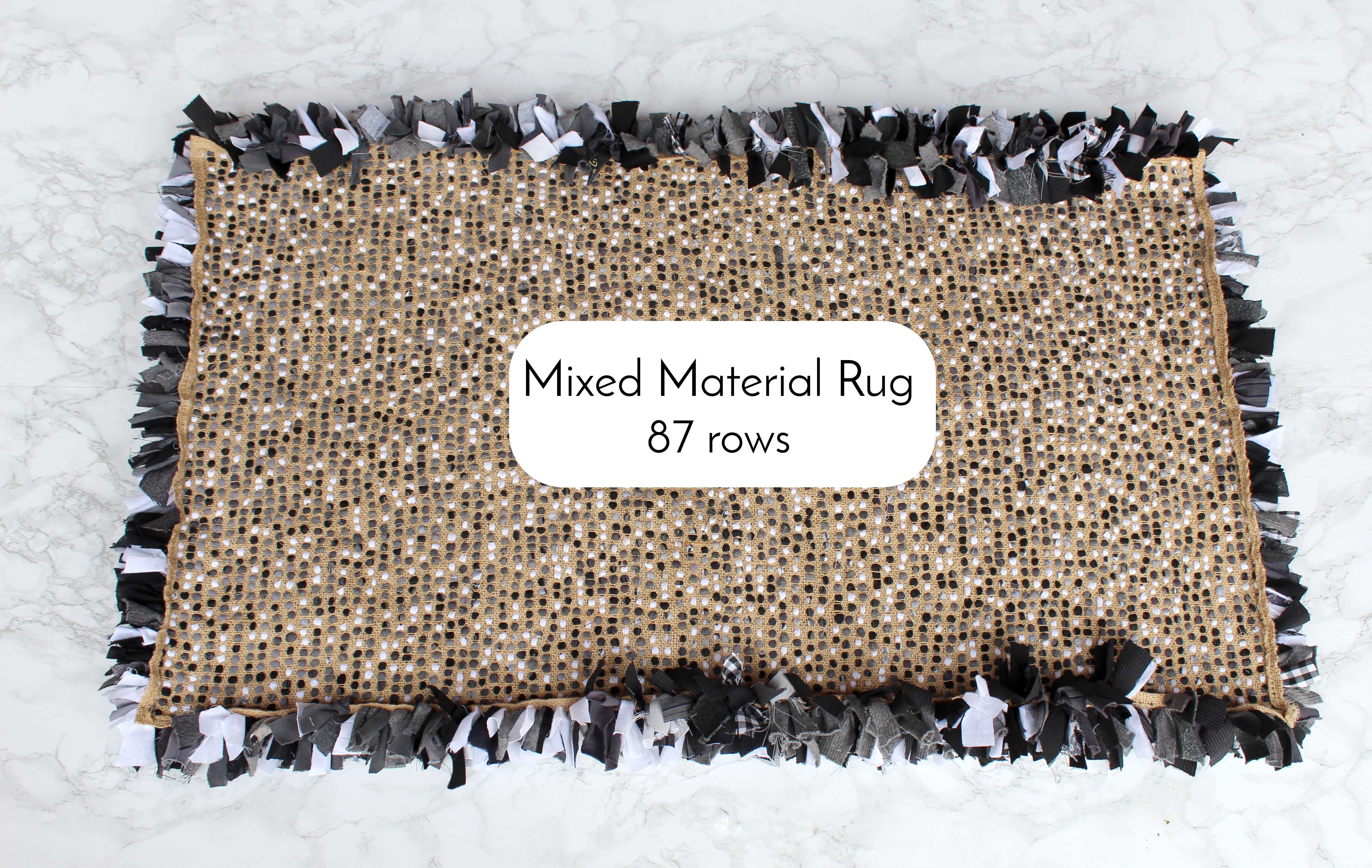 Black and white random shaggy rag rug from the back on the hessian