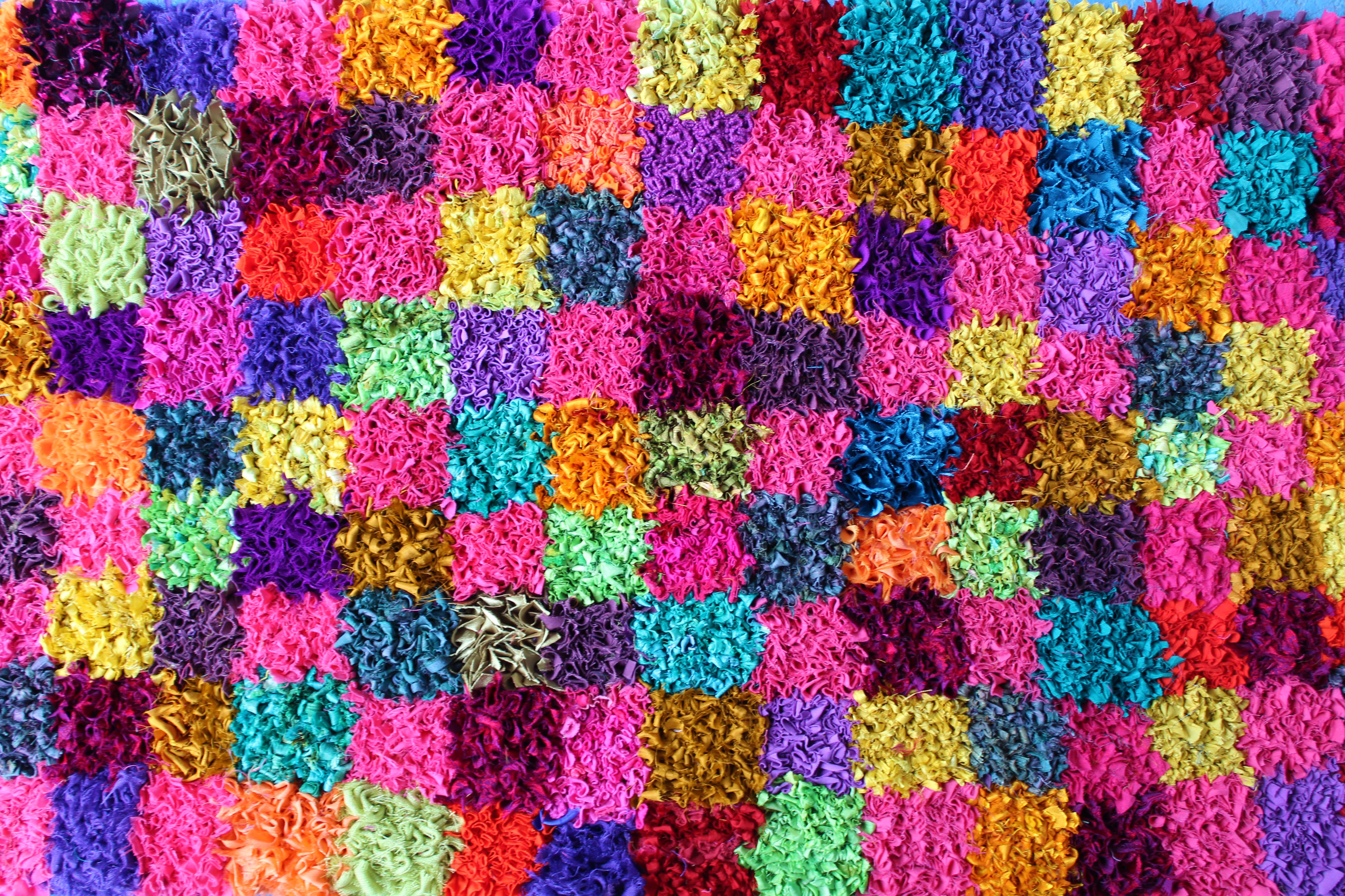 Checked silk rag rug in bright colours in the short shaggy rag rug technique