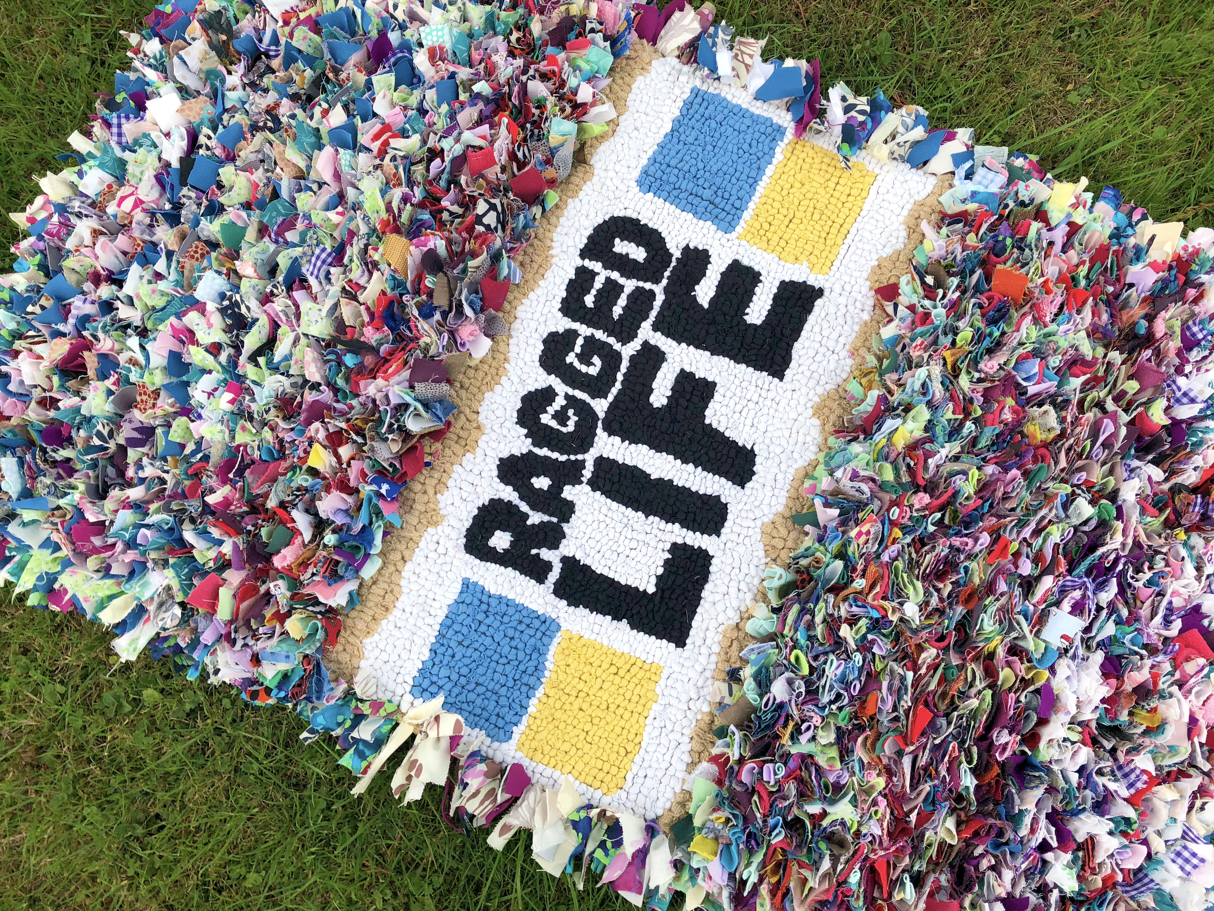 Ragged Life rag rug in loopy and shaggy rag rugging with logo