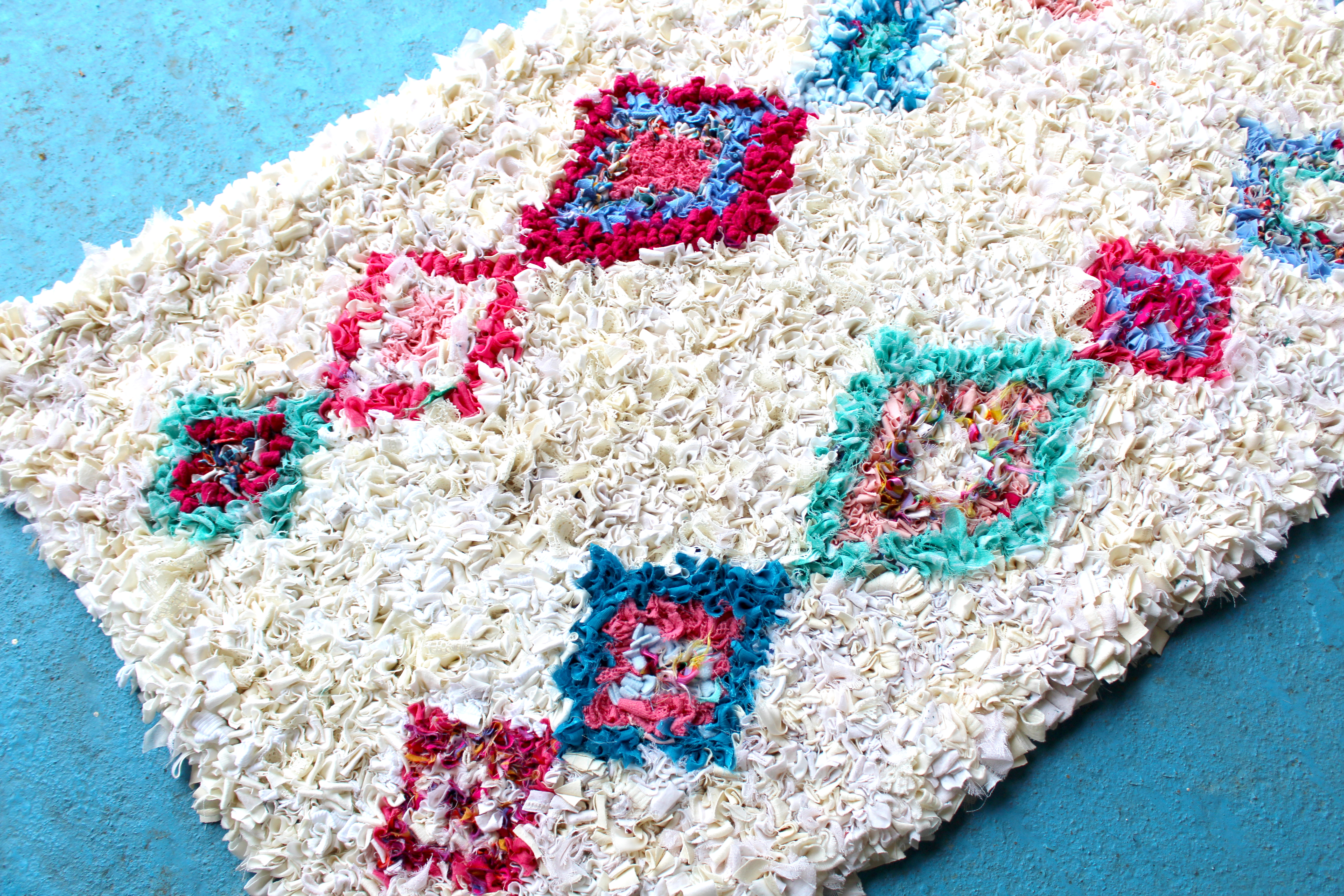Colourful rag rug with cream background made by Elspeth Jackson for Issue 103 of Mollie Makes