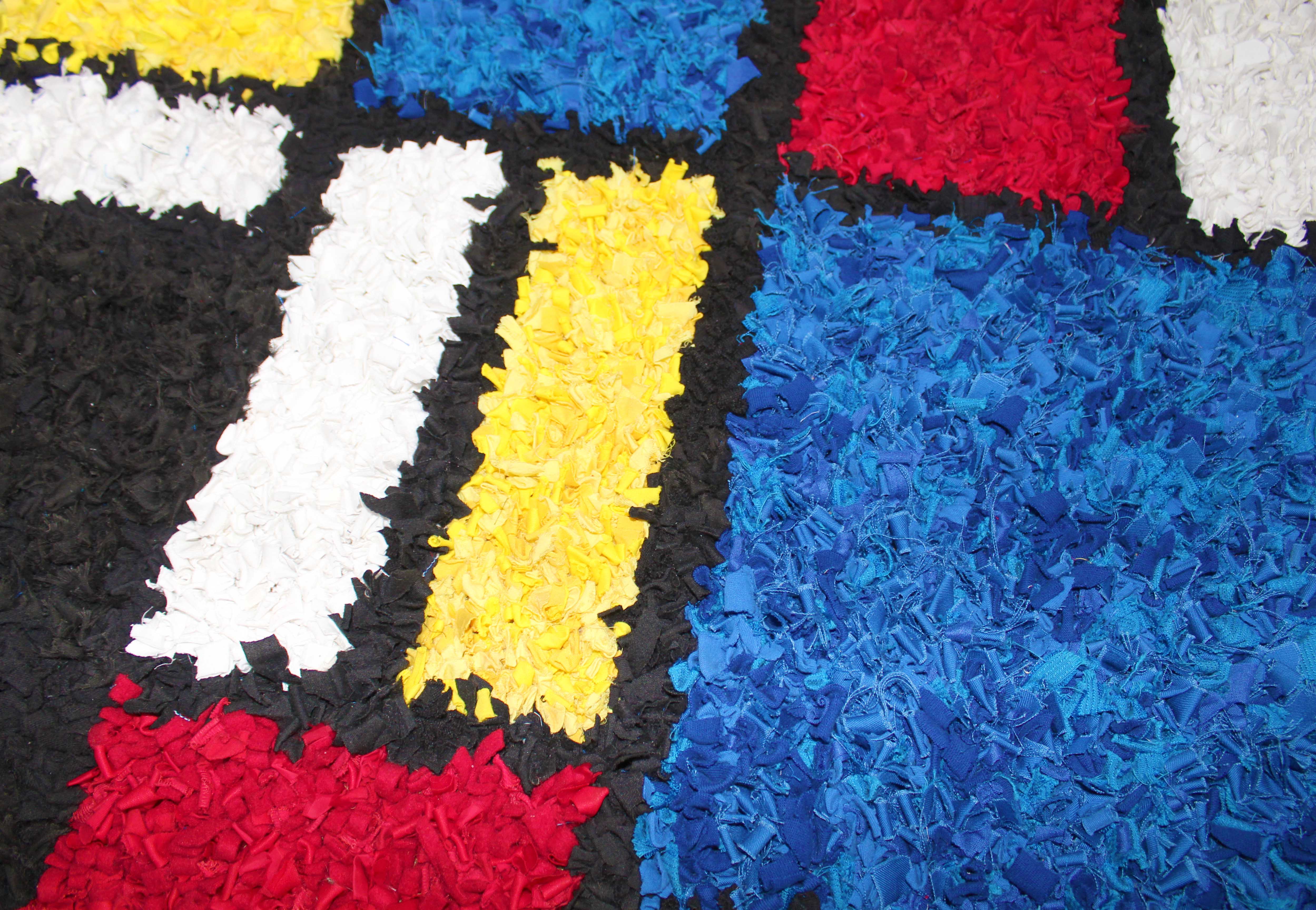 Eco-friendly short shaggy rag rug made using old t-shirts and textile waste