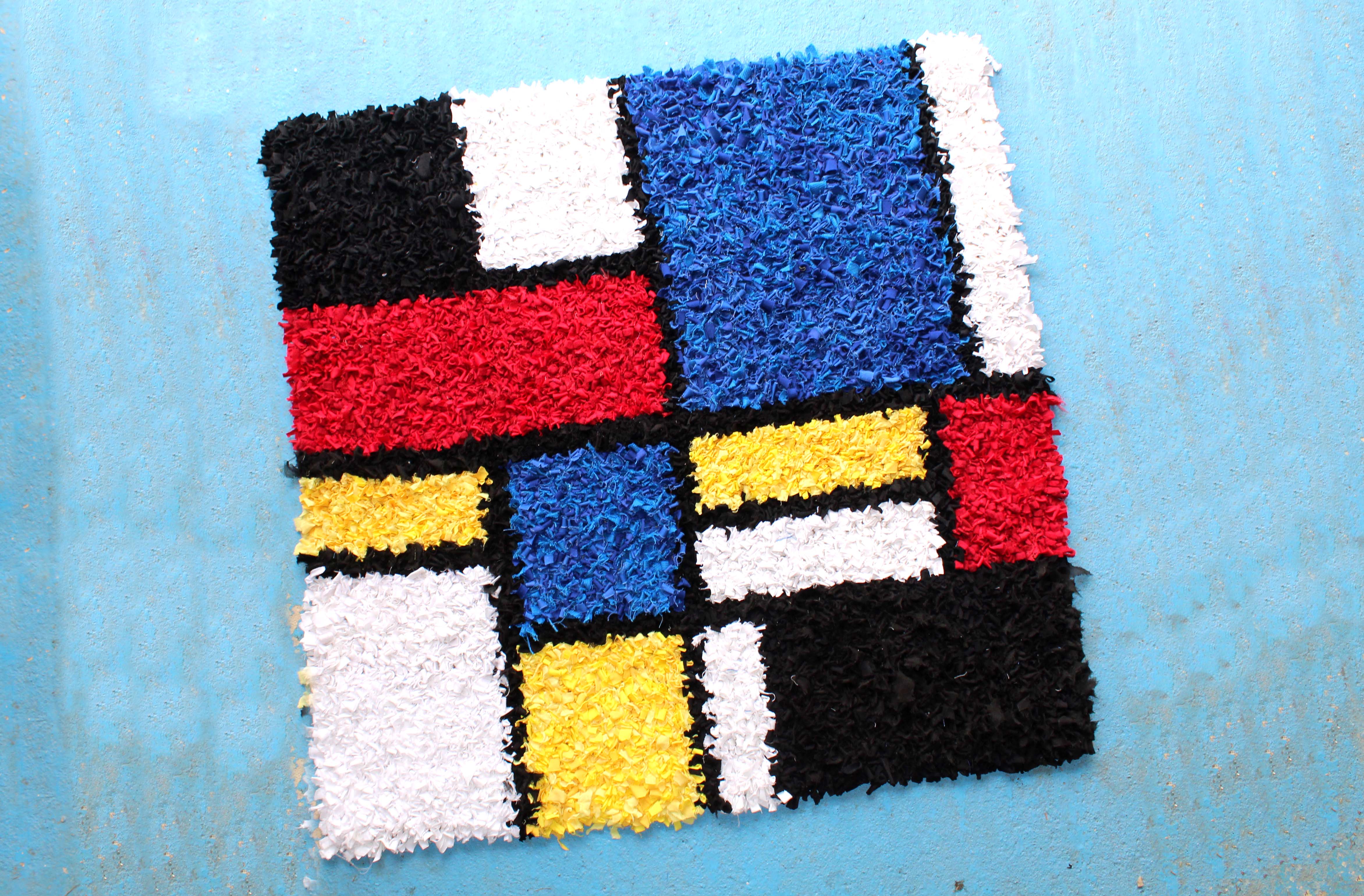 Ragged Life Mondrian Rag Rug made using recycled materials in blue, red, yellow, black and white primary colours. 