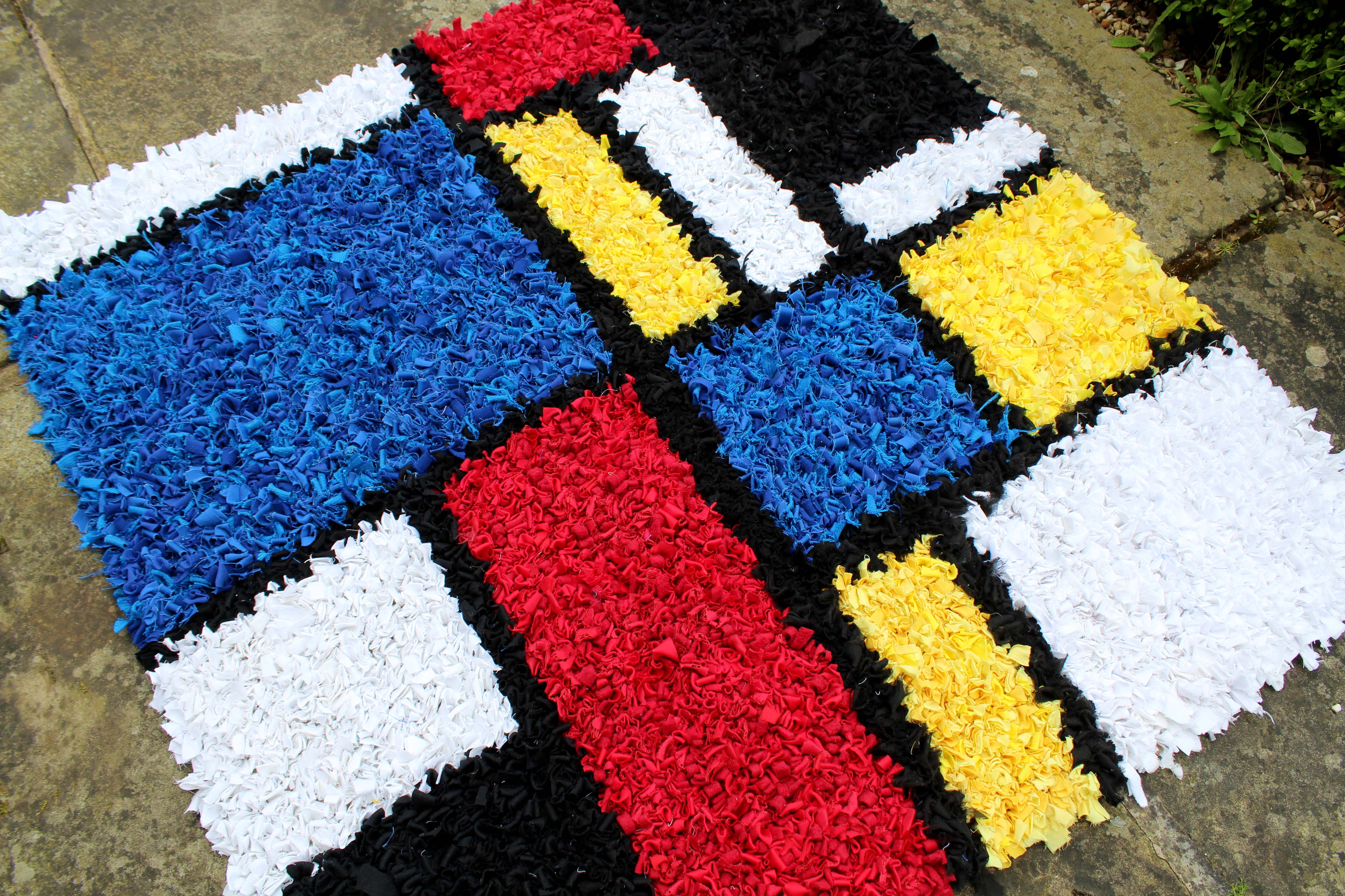 Mondrian artwork rug made using upcycled materials. 