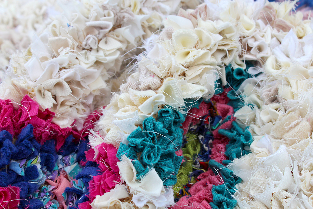 Individual upcycled fabric pieces in a rag rug