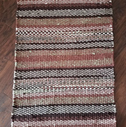 pinks and neutrals patterned twined rag rug