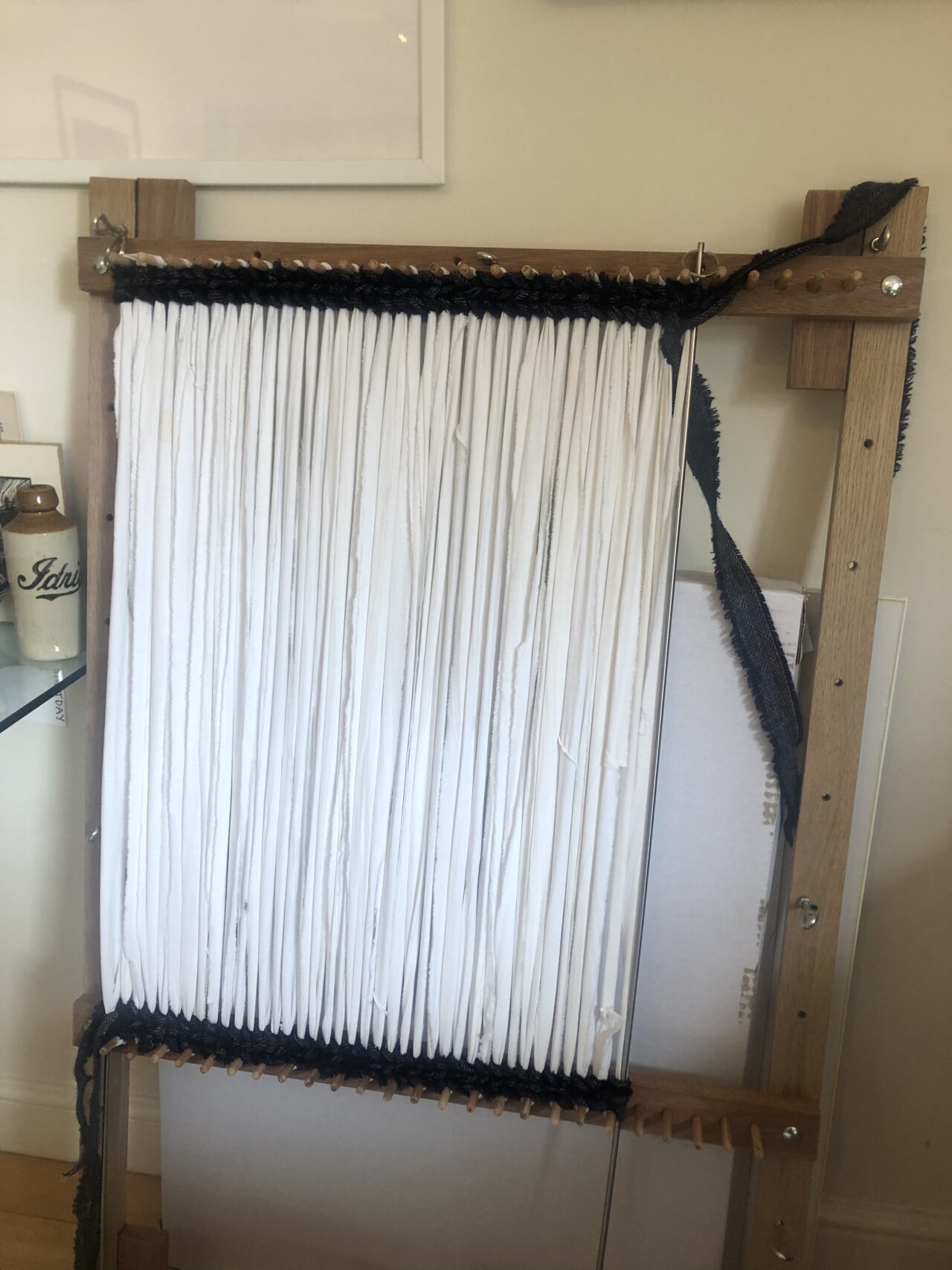 Starting a twined rug on a basic wooden loom