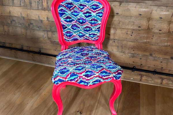 Colourful upholstered rag rug chair