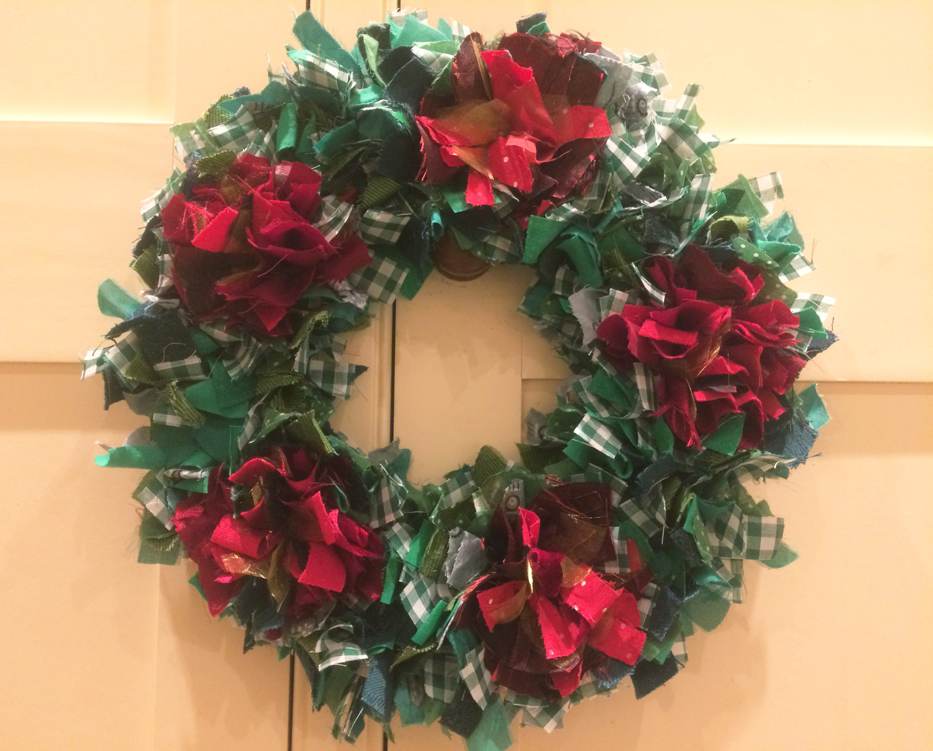 Traditional shaggy rag rug christmas wreath made using recycled materials by Cathy. 
