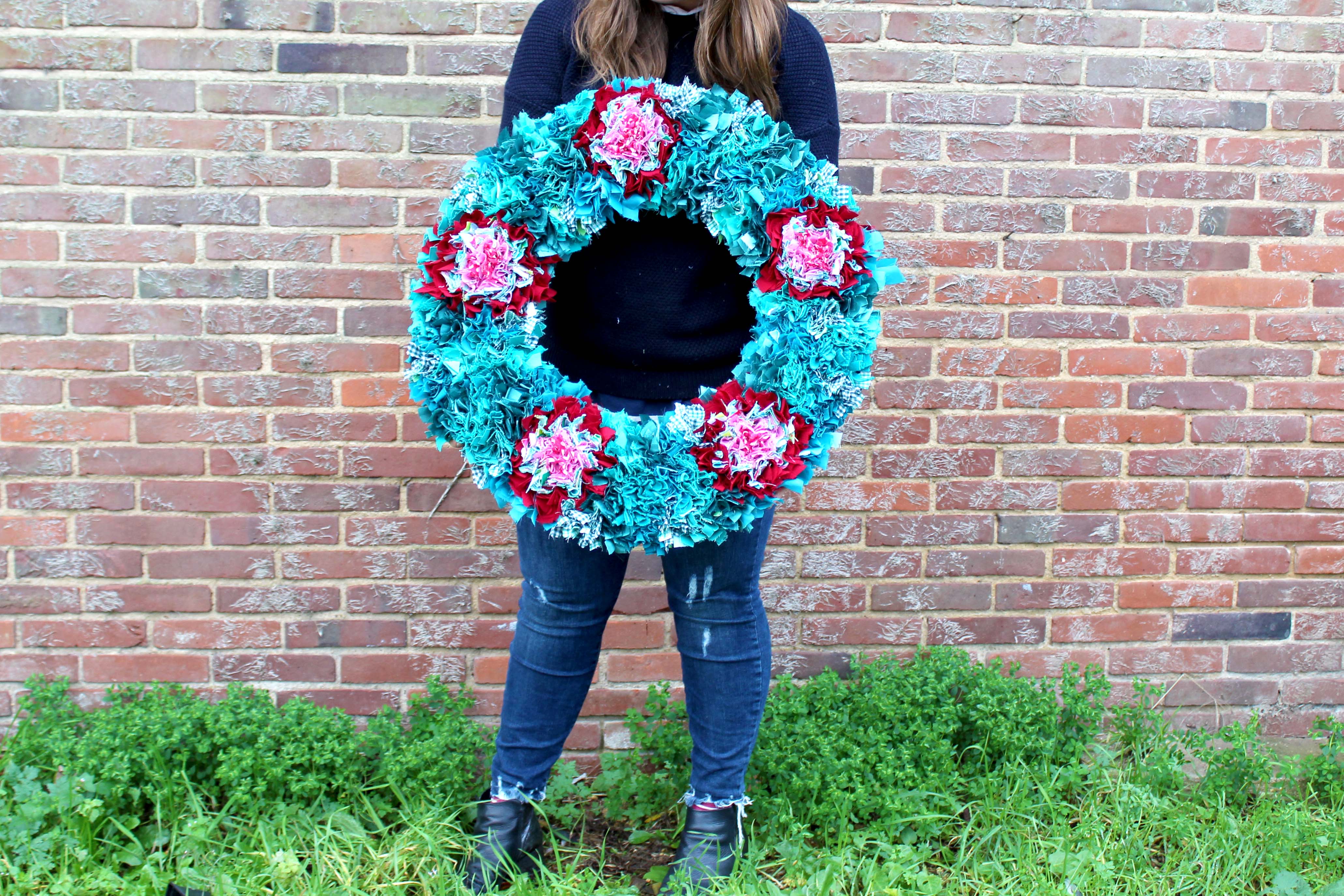 Extra large green and red rag rug xmas wreath made using recycled clothing and sewing offcuts. 