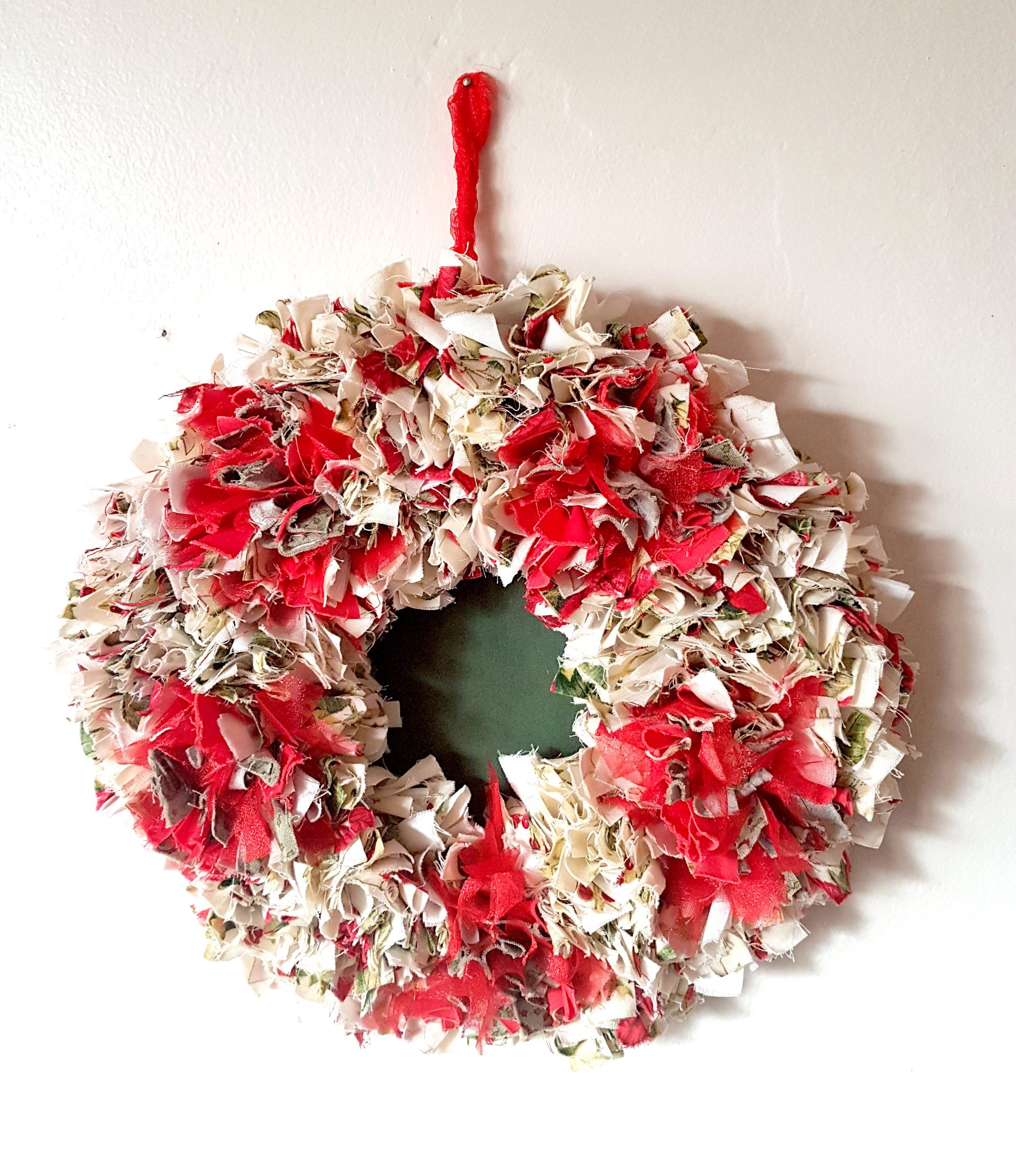 Red and gold rag rug christmas wreath made on a Ragged Life workshop