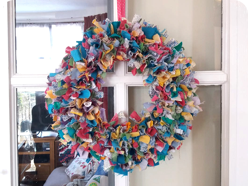 Multicoloured Spring Rag Rug Wreath made using fabric offcuts and old clothing scraps
