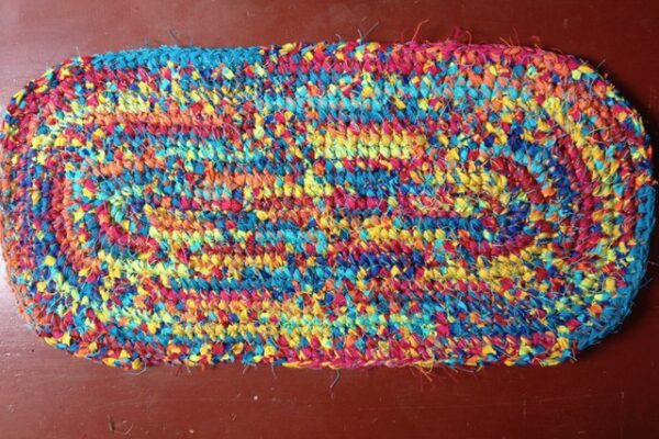 Multicoloured crocheted rag rug