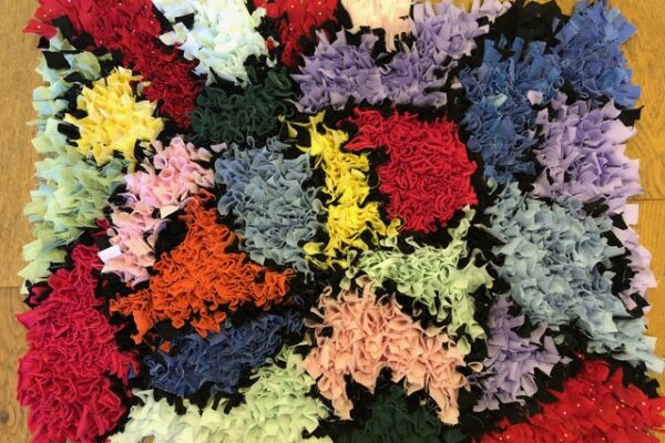 Stained glass window inspired rag rug with blocks of colour
