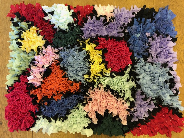 Stained glass window inspired rag rug with blocks of colour
