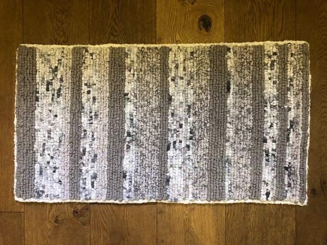 Neutral coloured grey locker hooked rag rug