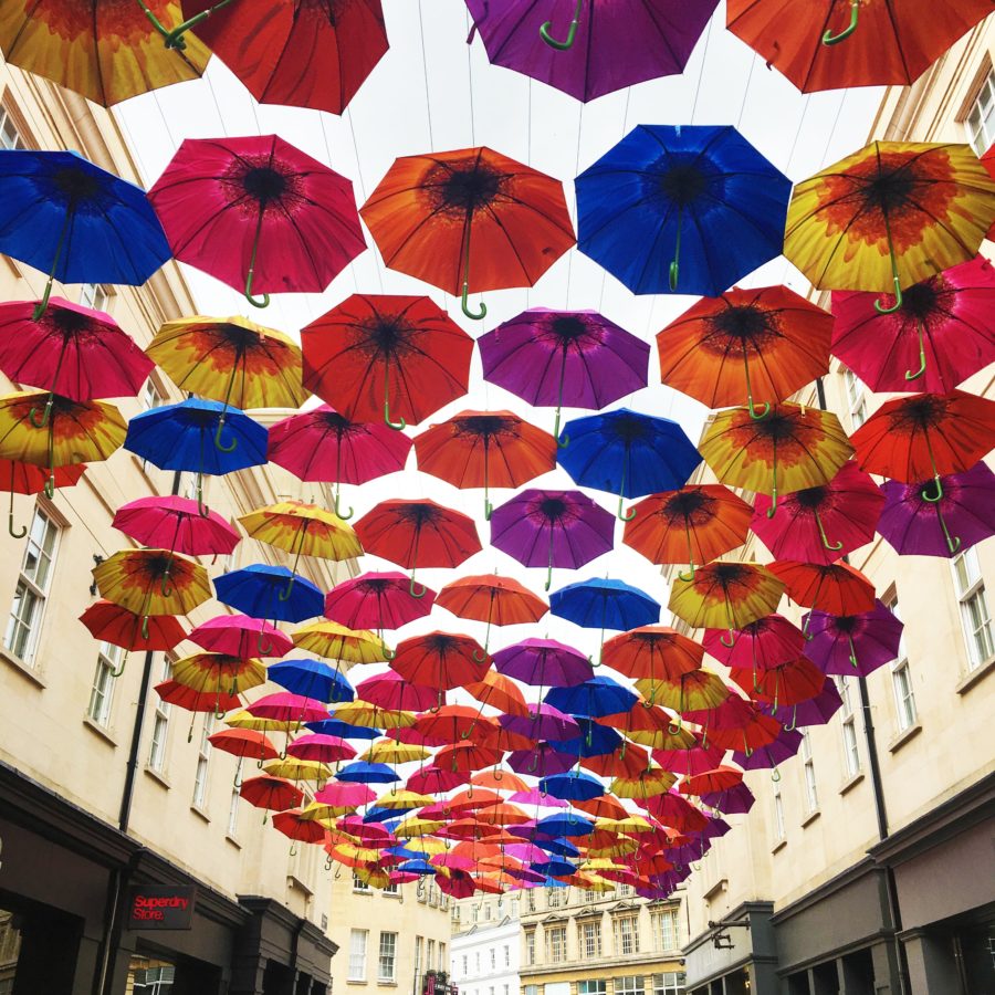 Colourful umbrellas suspended over the road in Bath City Centre