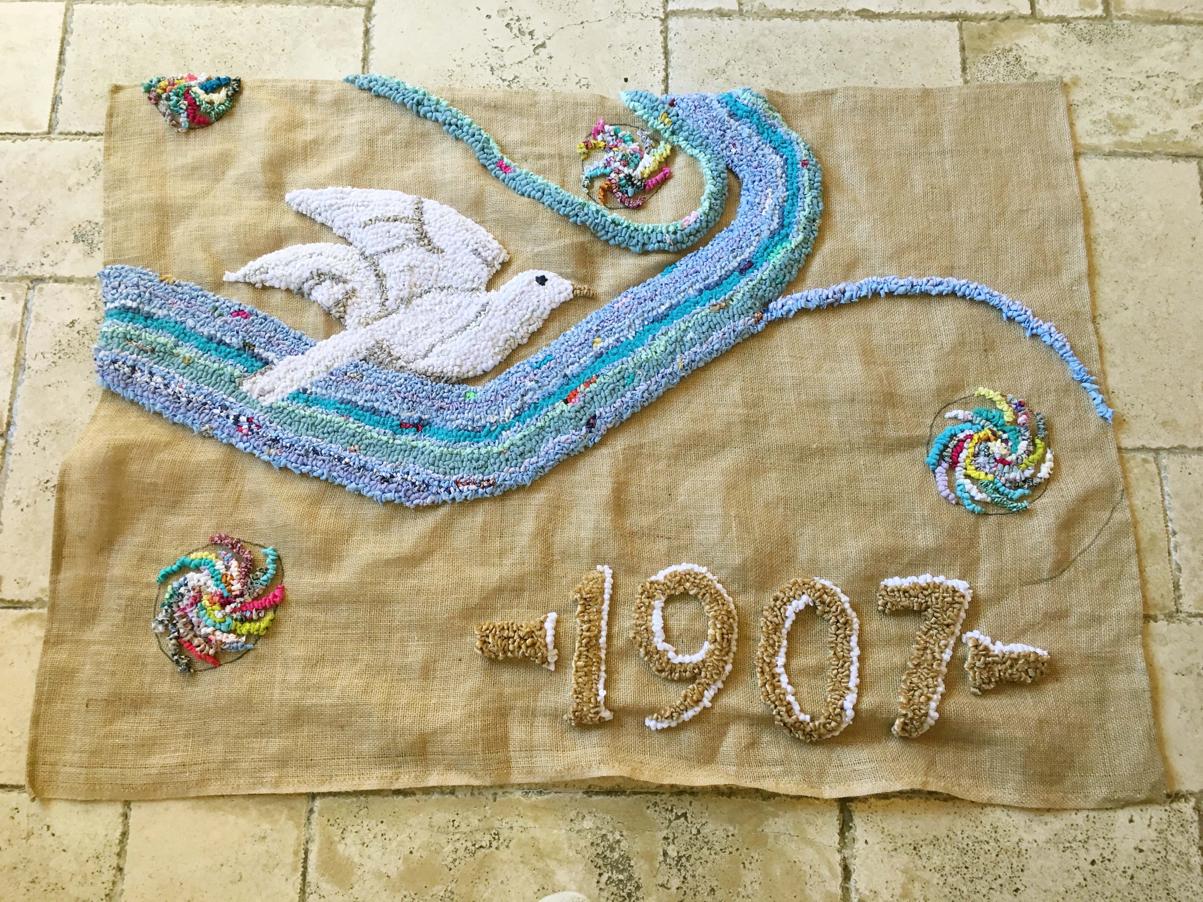 Hooky Rag Rug Wall Hanging with white dove and 1907