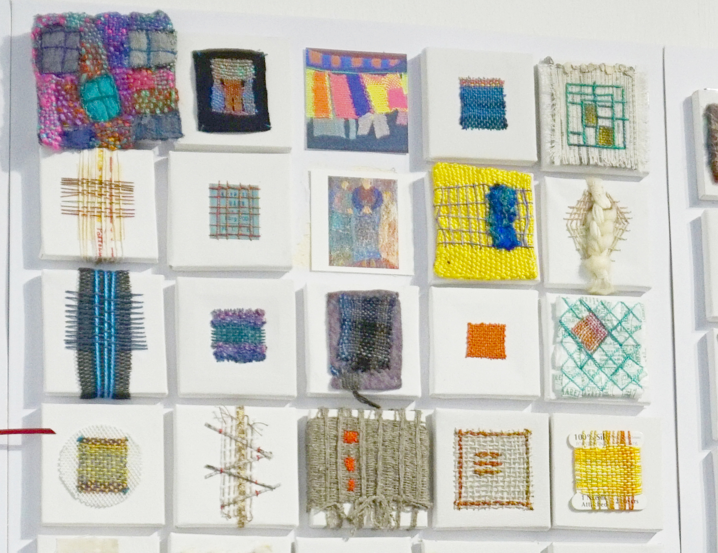 Small detailed pieces of textile art in an exhibition at the Knitting and Stitching Show 2017