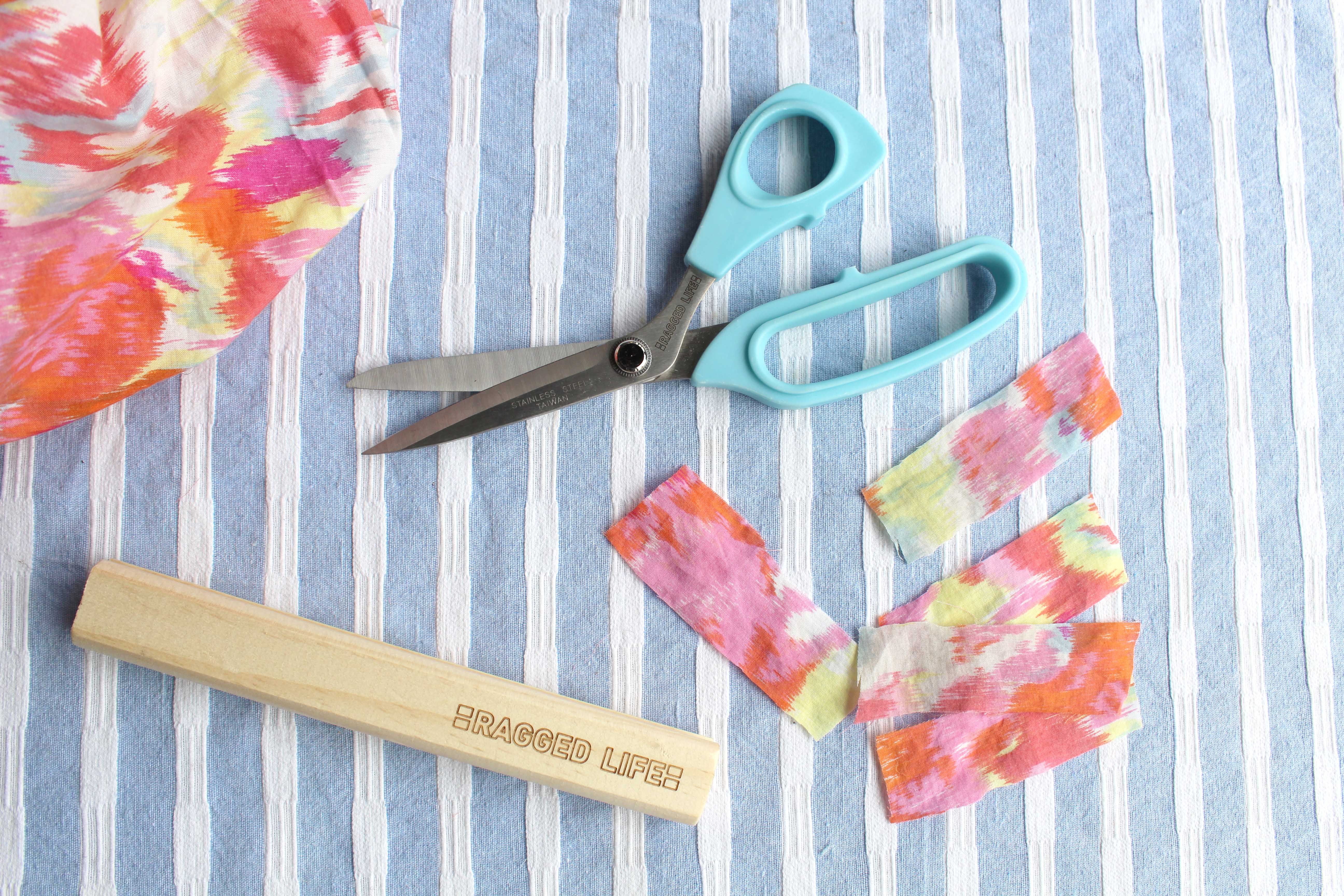 Cutting fabric for rag rugs using rag rug scissors and a wooden gauge