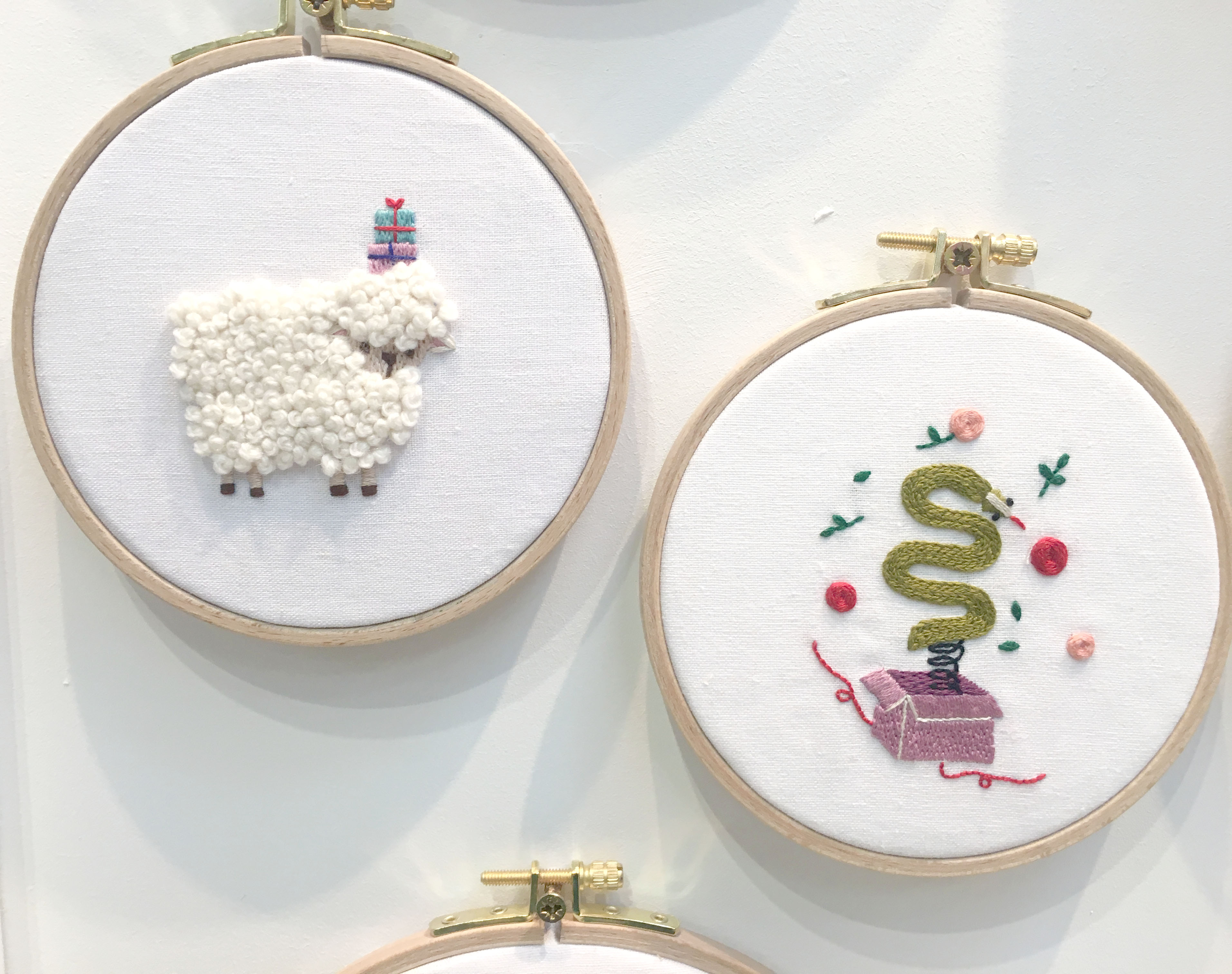 Sheep and snake embroidery in wooden embroidery hoops