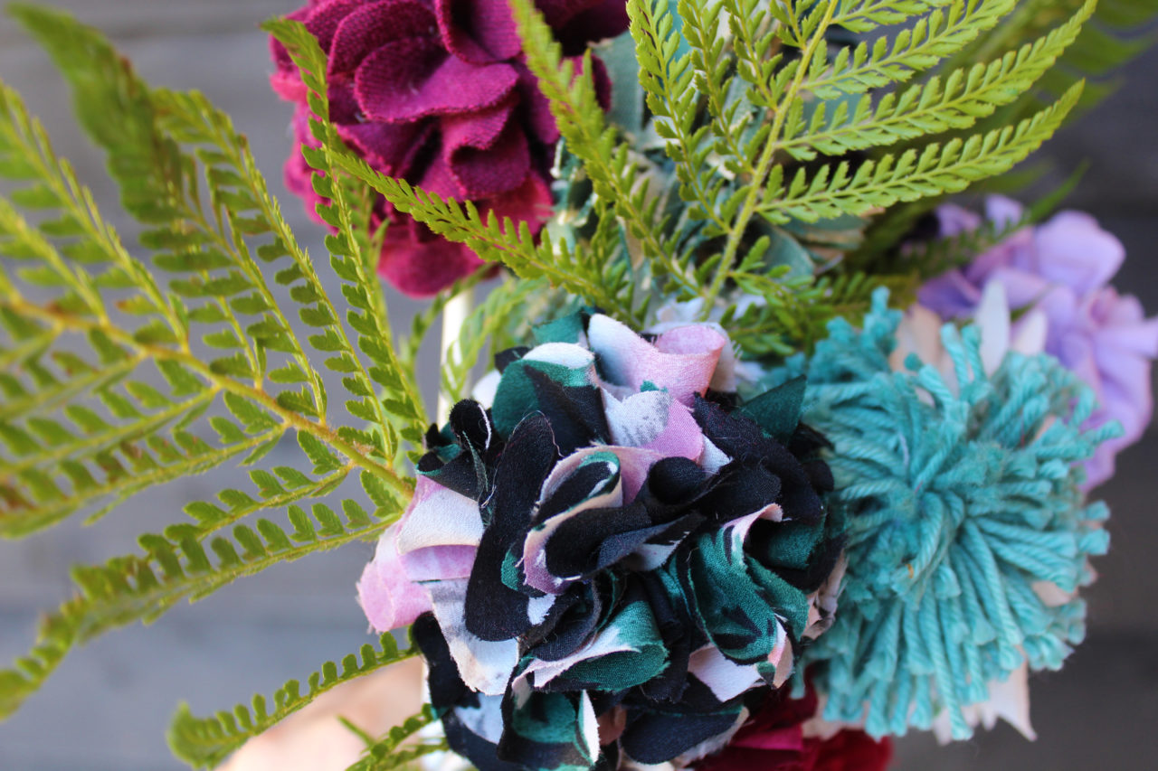 Rag rug flowers made on a hessian base in black and pink colours