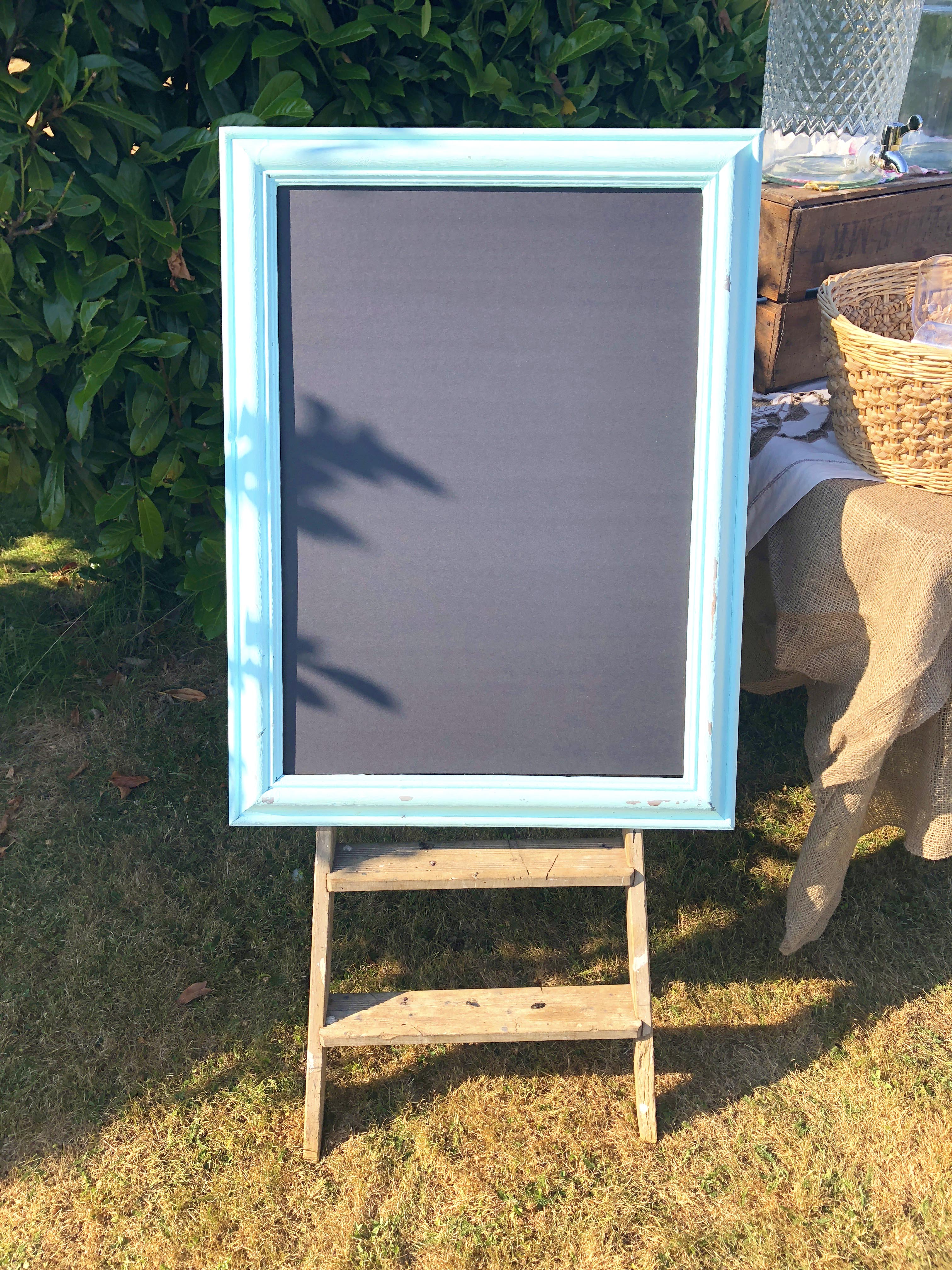 Instax board frame for a wedding or hen do displayed on a vintage ladder
