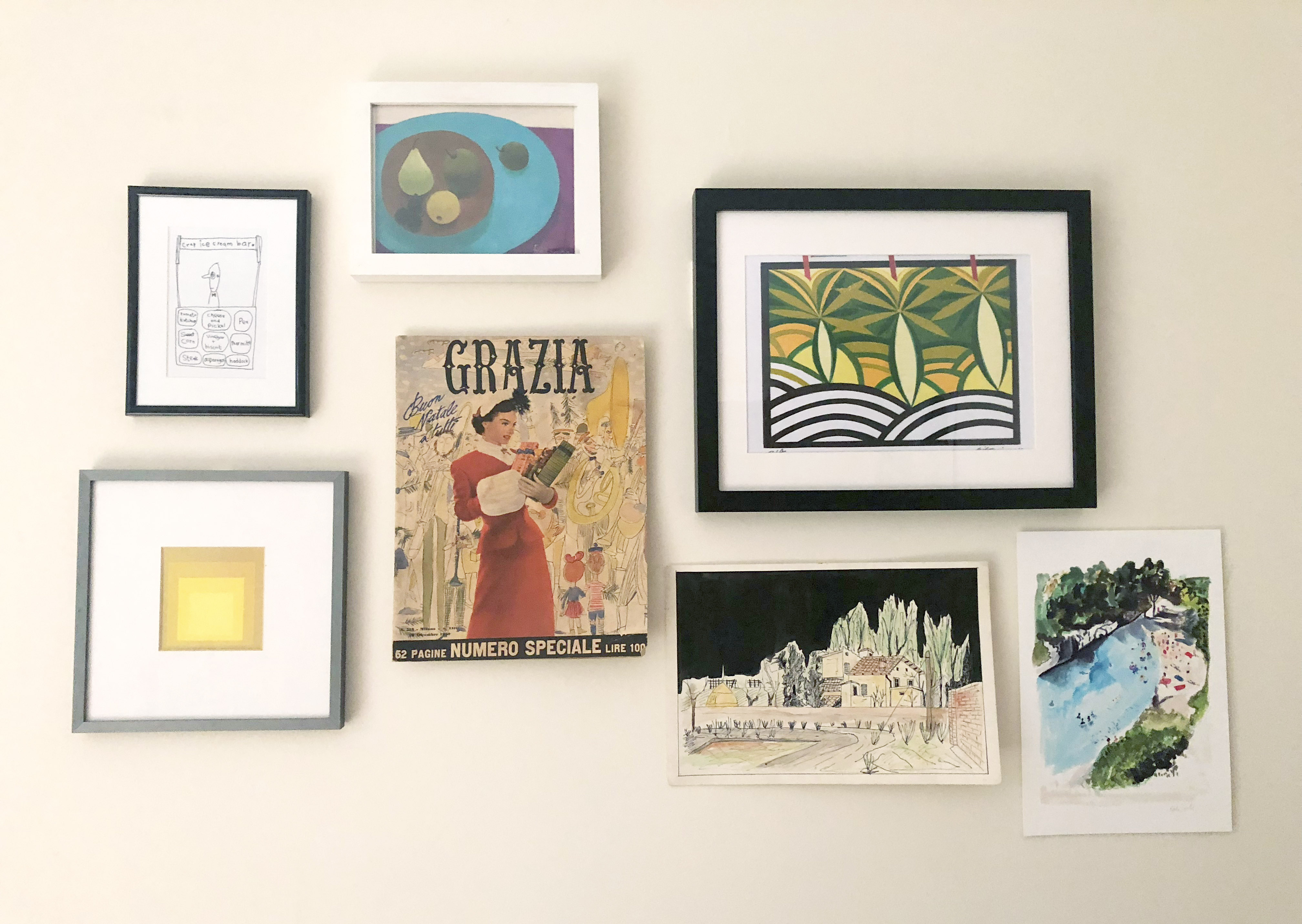 Feature wall with vintage Grazia magazine, cuban art and lithographs