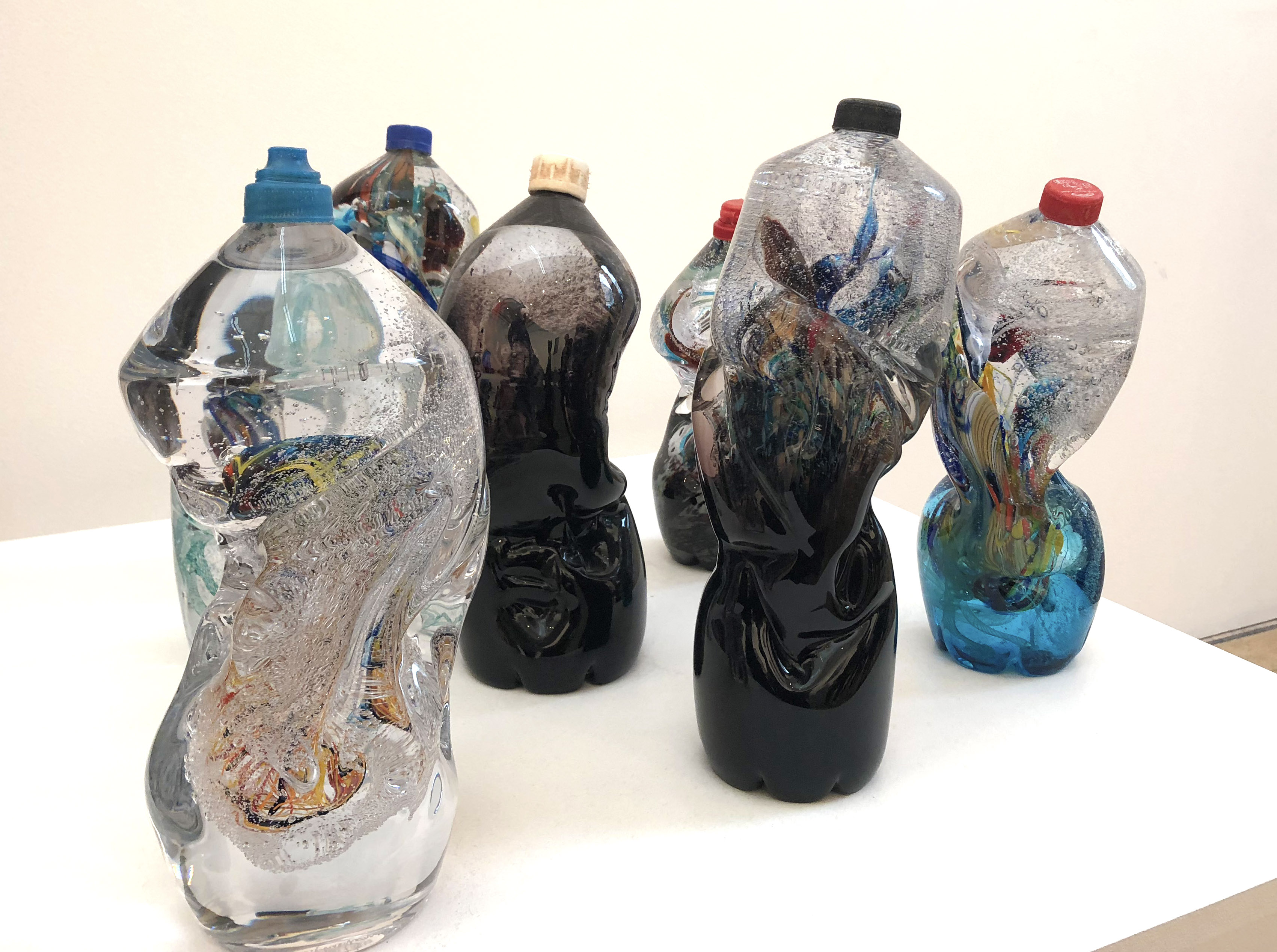 The Seven Stages of Degradation by Sophie Thomas and Louis Thomas glass bottles with plastic tops murano style