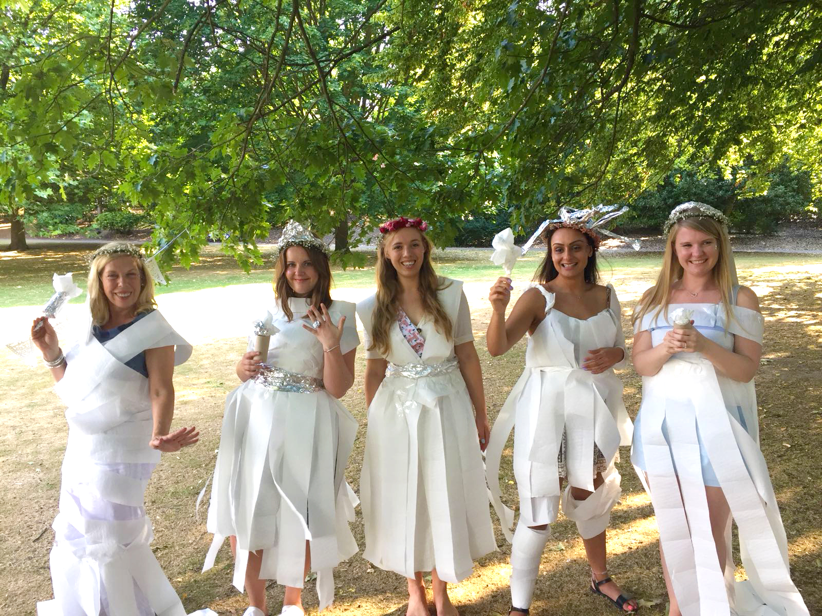 Hen do wedding dress game with dresses made of toilet roll and silver foil.