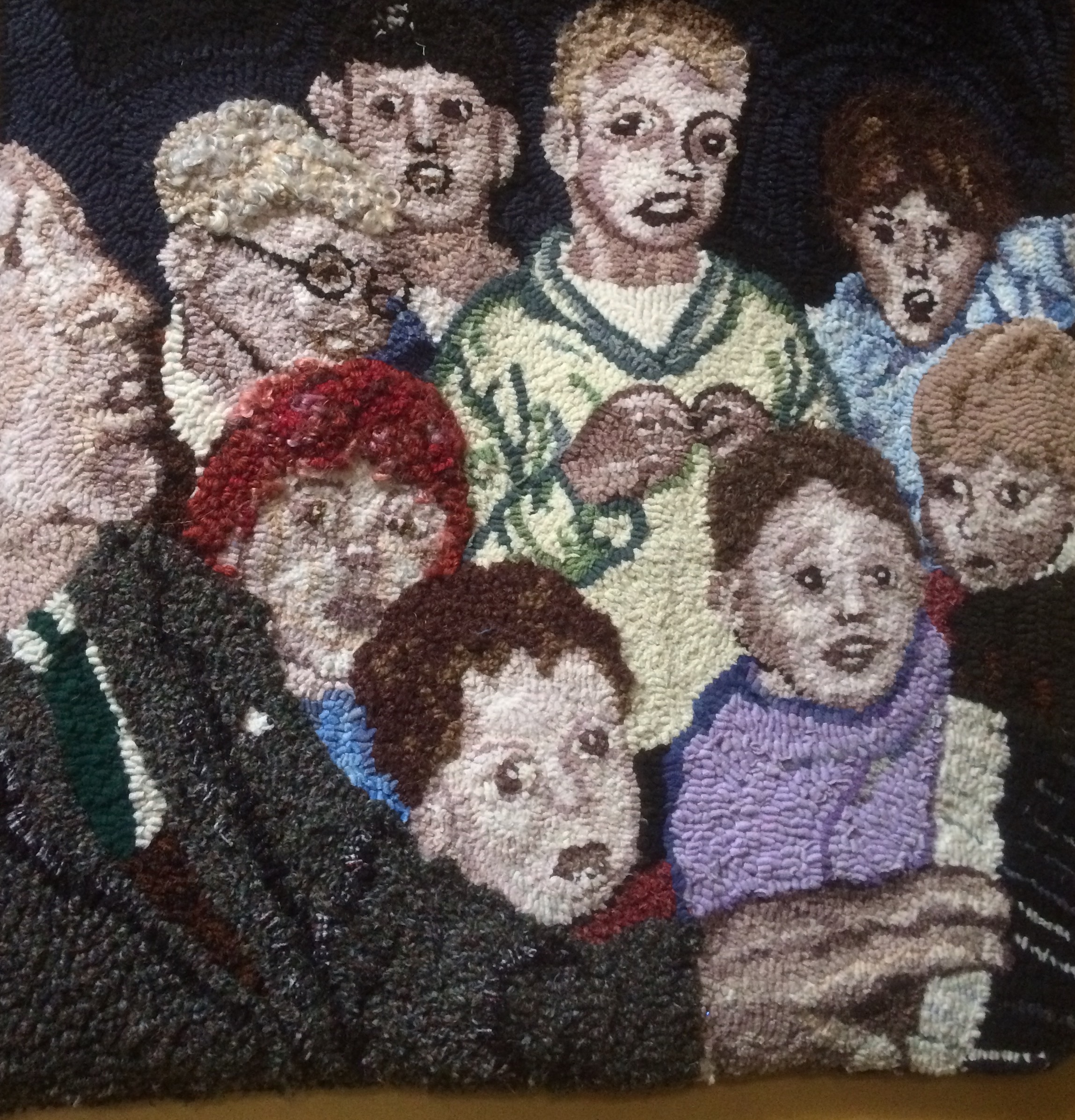 Man playing the piano with children rag rug artwork made by Heather Ritchie