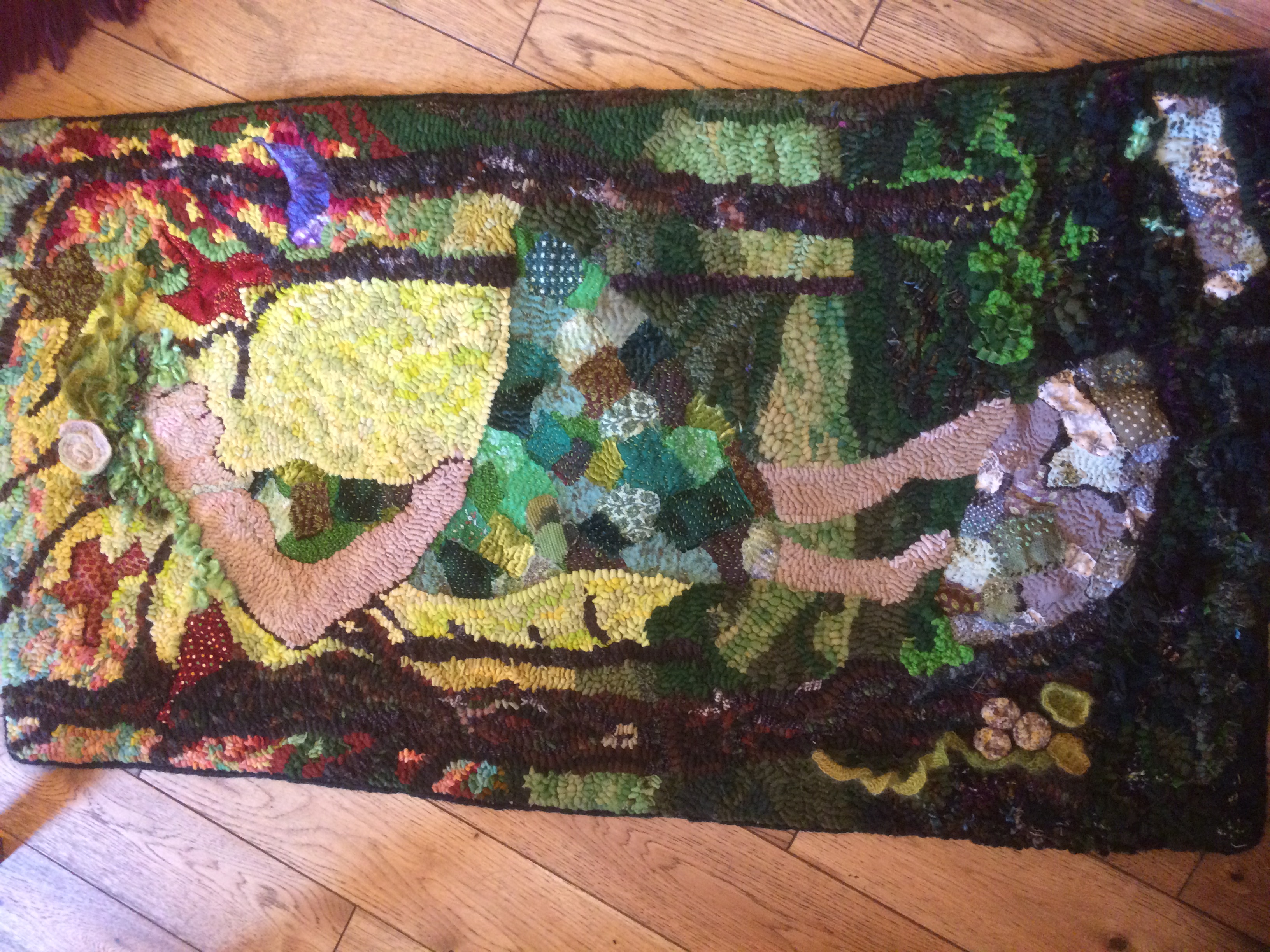 Intricate Rag Rug Design of a lady with patchwork skirt done in the loopy style