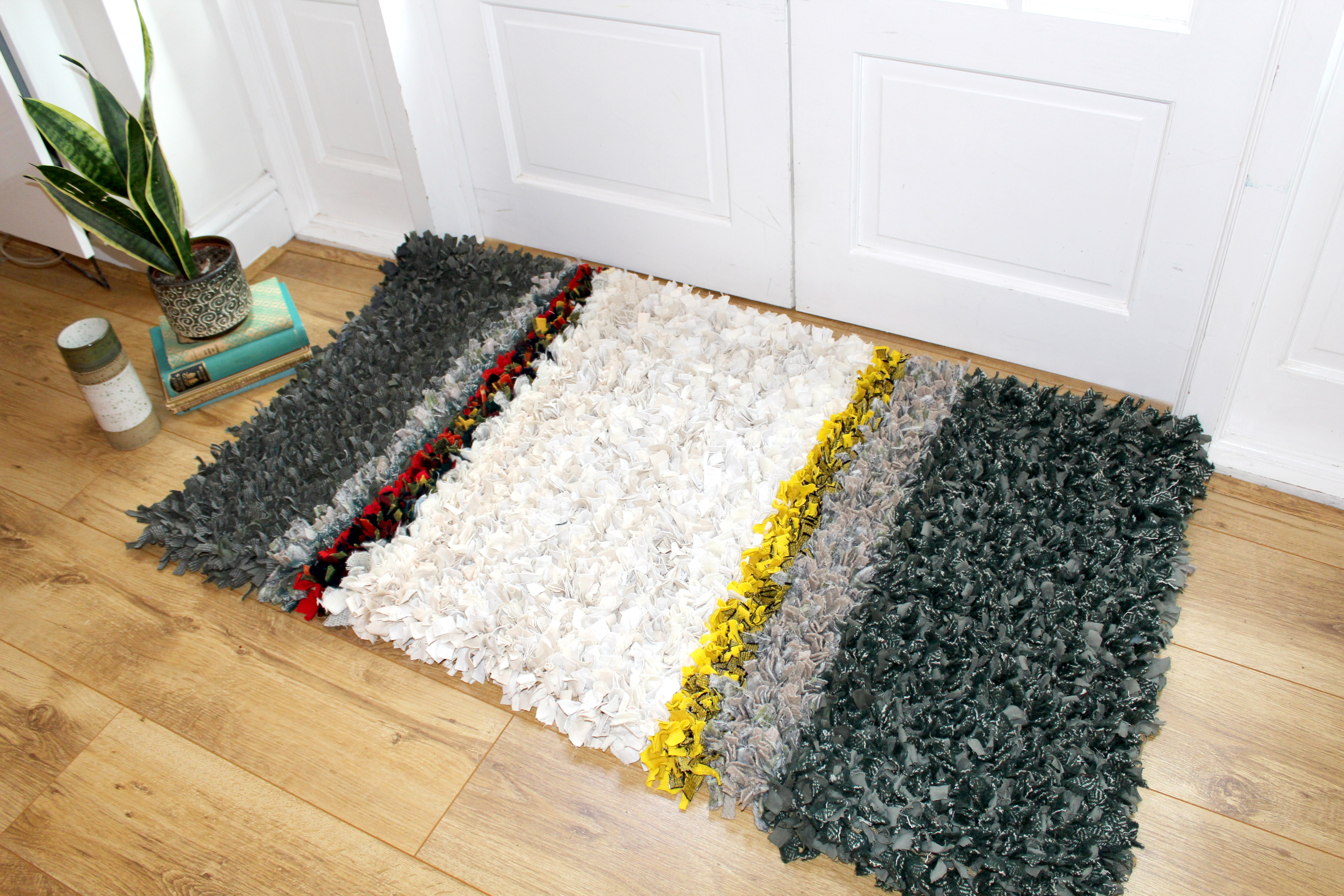 Ragged Life Rag rug on floor made using textile waste and clothing offcuts