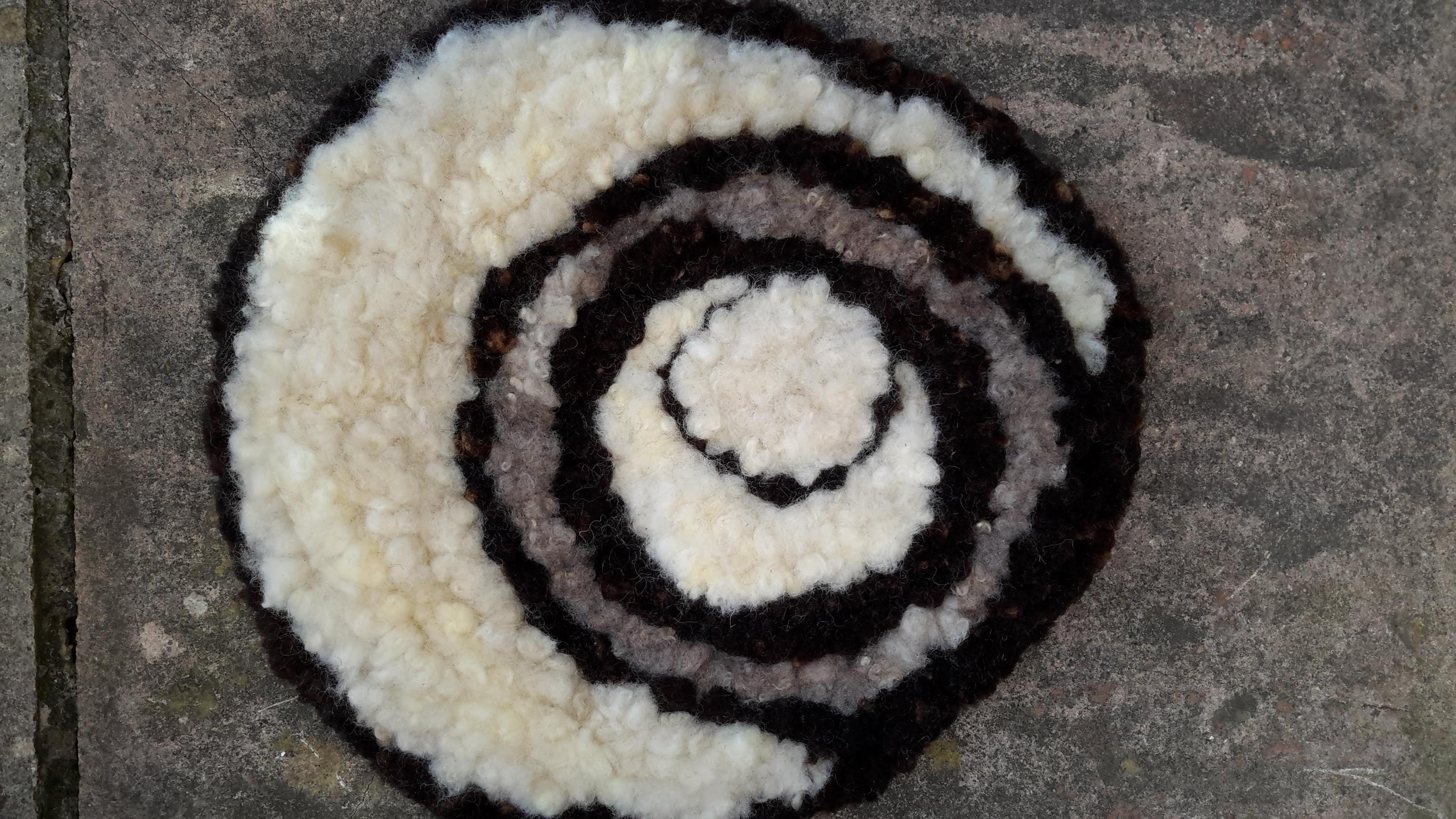 Crop circles black and white rag rug made of Jacob fleece