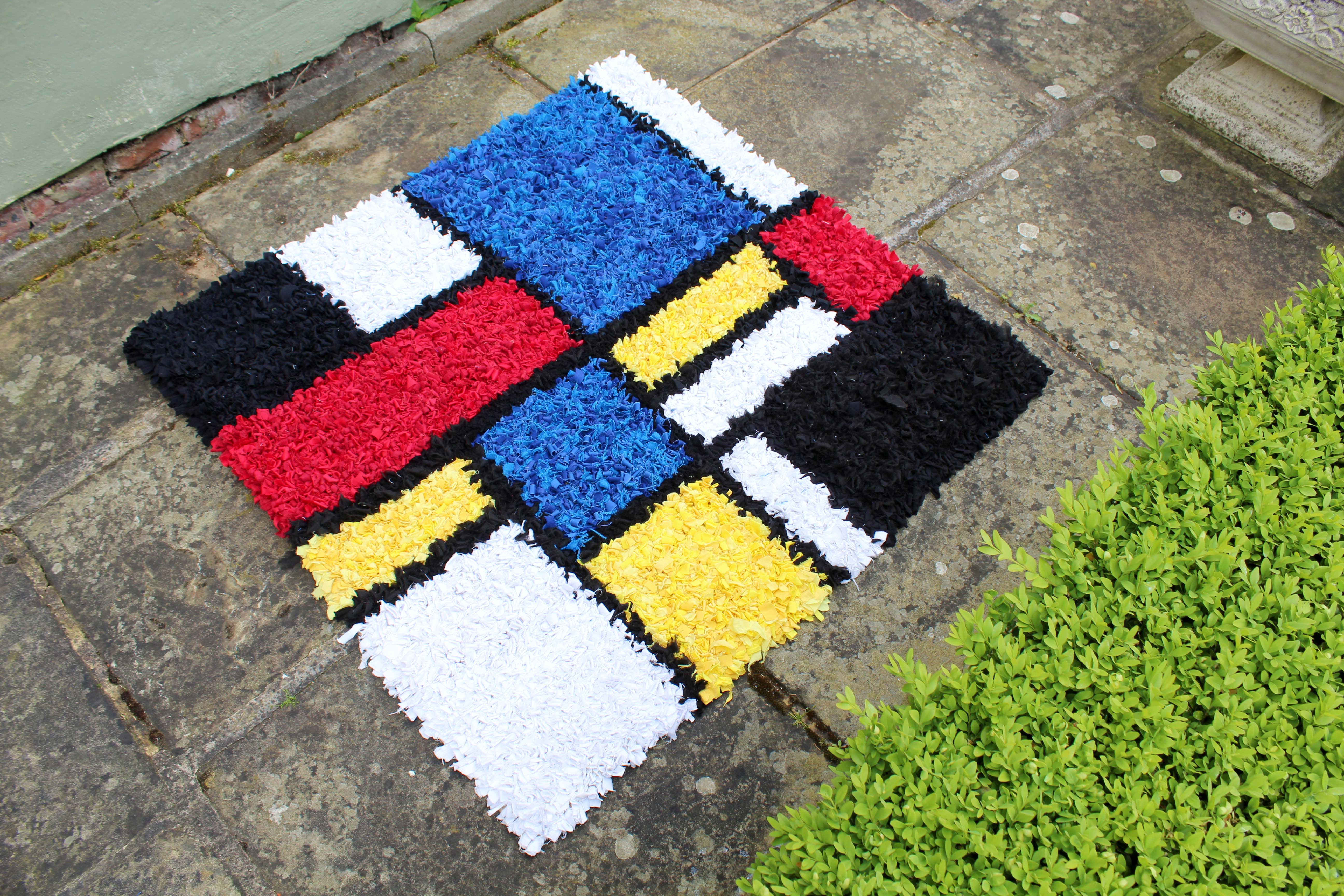 Striking rag rug made using primary colours based on Mondrian the artist's work