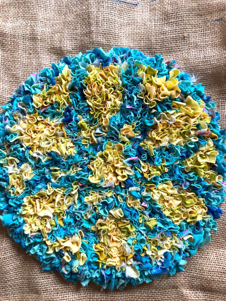 Stained glass inspired blue and yellow rag rug section