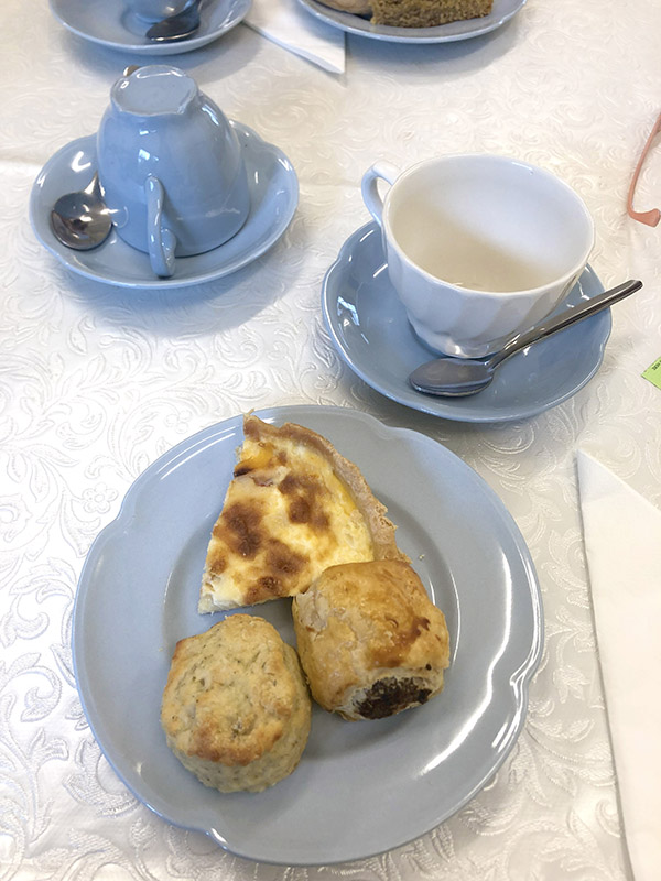 Savoury snacks at afternoon tea in Blindcrake with blue china and quiche