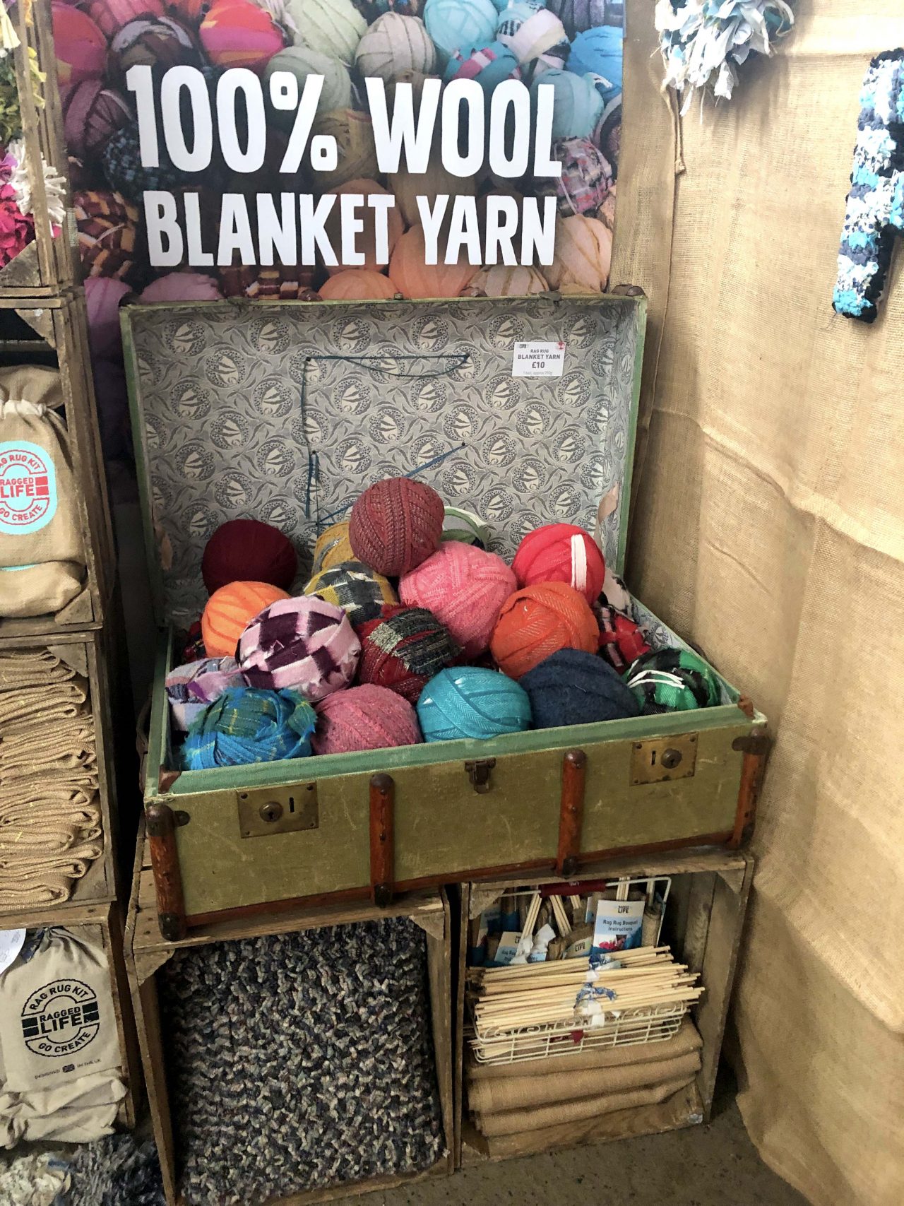 Ragged Life rag rug stand at Woolfest 2019 in Cockermouth, Cumbria festival with balls of multicoloured blanket yarn