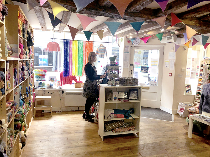 Inside Knit and Stitch Shop in York with knitted bunting