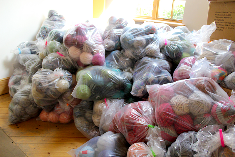 Bags of 100% wool blanket yarn in a pile ready for organising