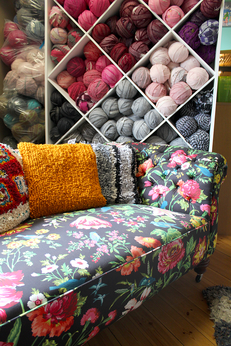 Beautiful craft storage with statement sofa and rag rug cushions