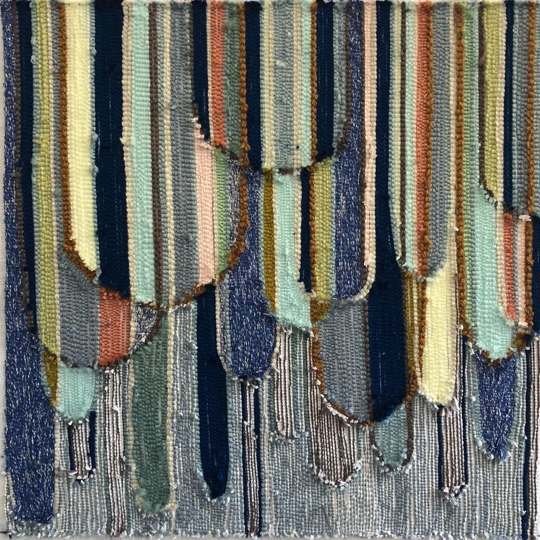 Blue, green and black textile art
