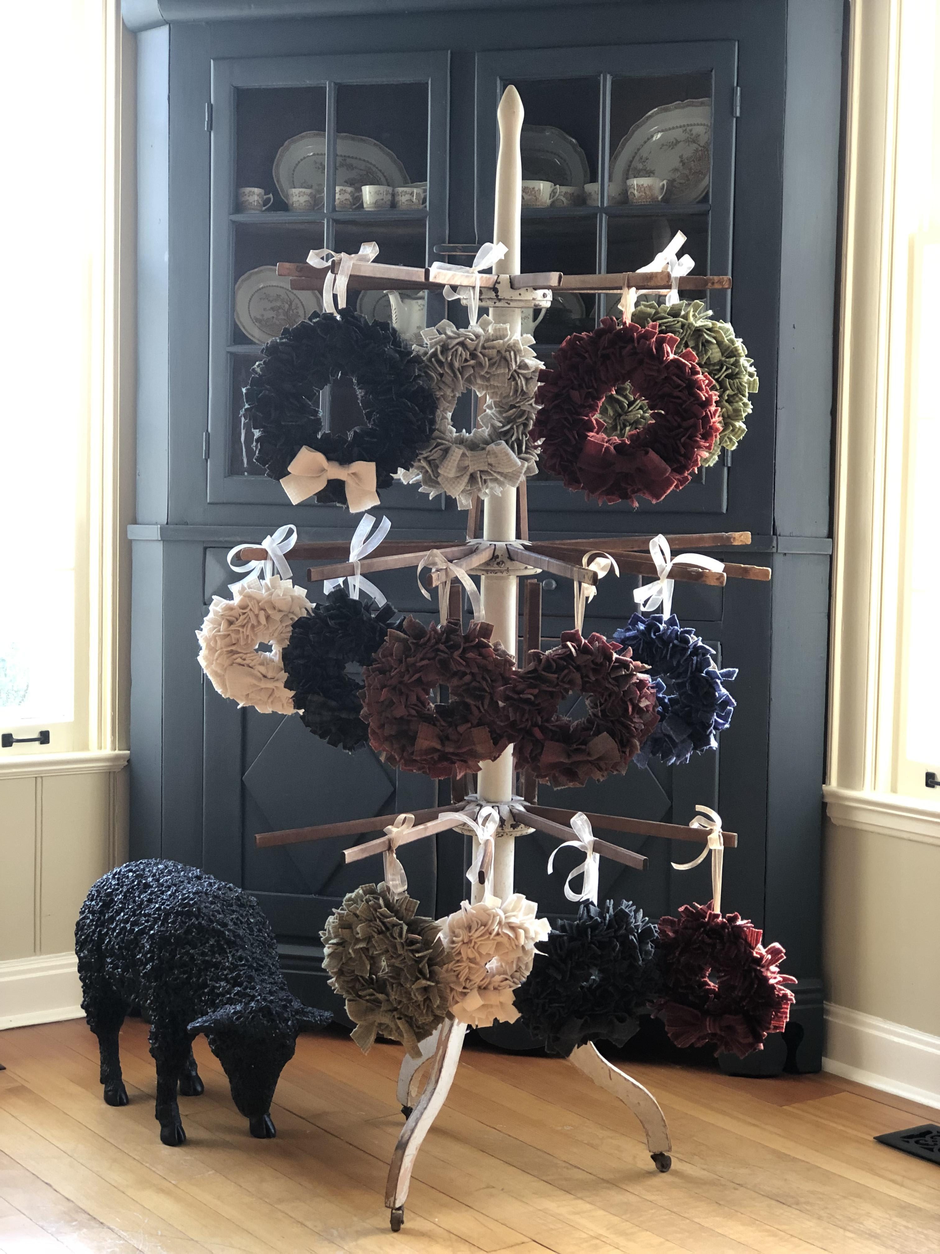 Christmas decoration mini wreaths hanging on a display by Yvonne Iten-Scott