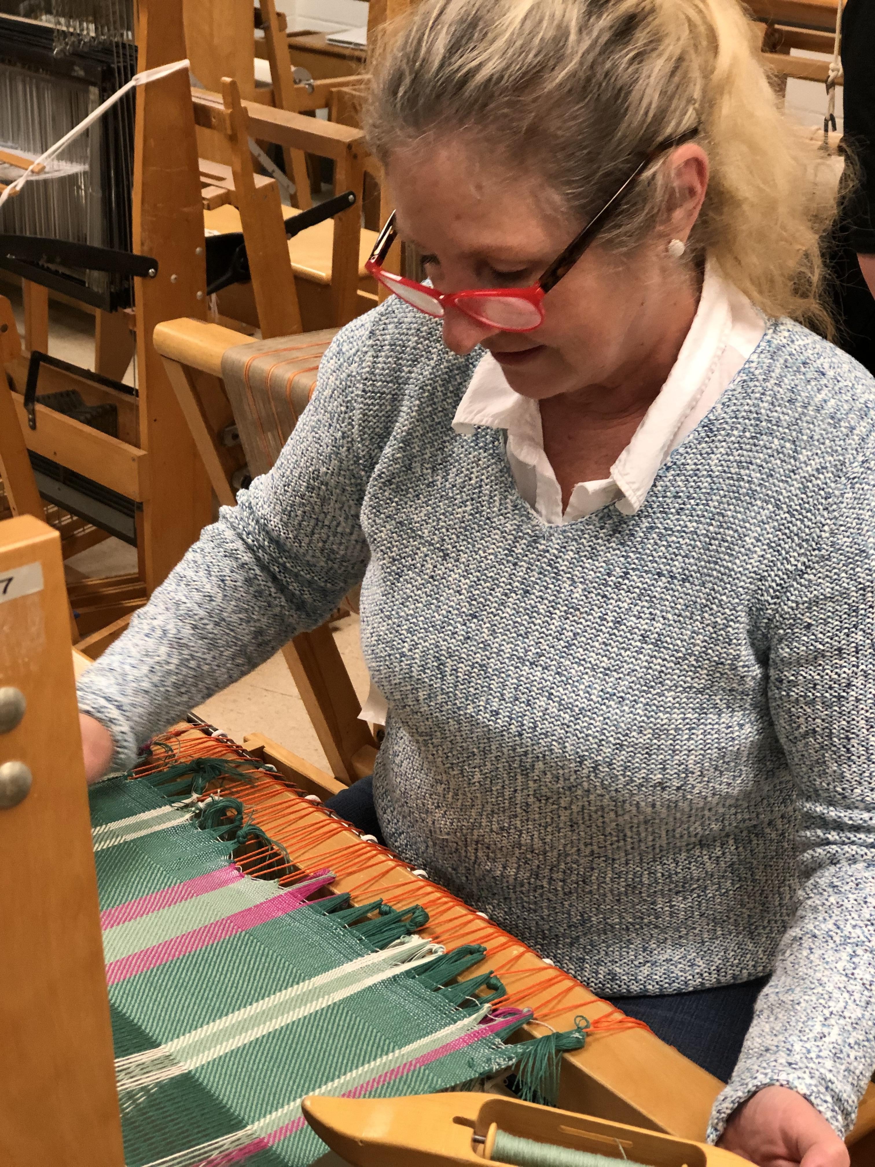 Yvonne Iten-Scott learning to weave a rug
