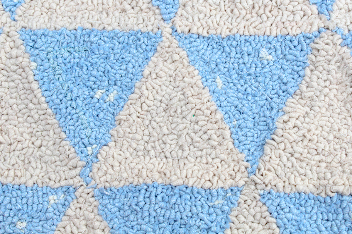 Up close detail of woollen rag rug