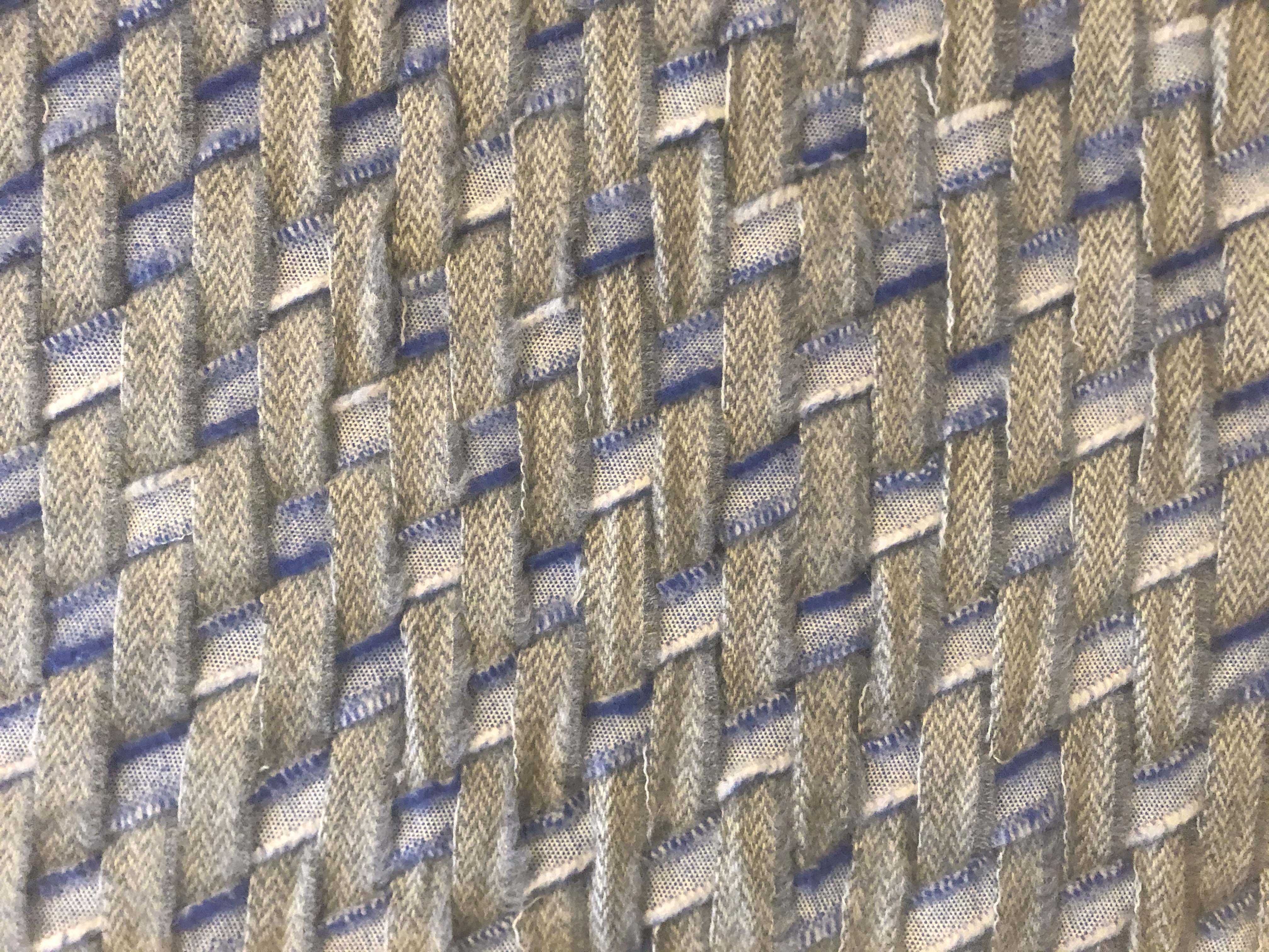 Close up of woven grey and blue fabric