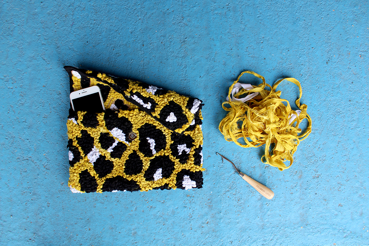 Yellow leopard print clutch bag made using fabric offcuts